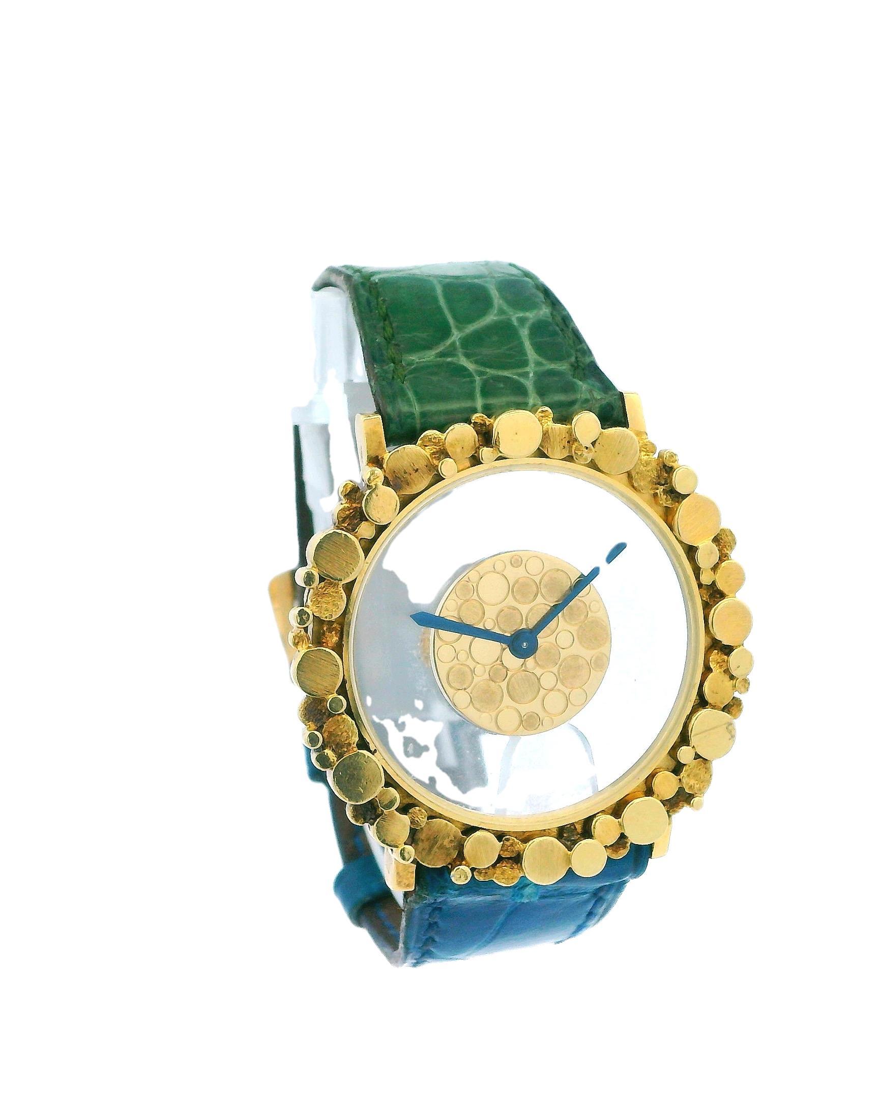 The Jaeger-LeCoultre Mystery Dial 18K Yellow Gold Nugget Watch is an exquisite timepiece showcasing luxury and craftsmanship. The watch features a striking 37mm nugget-style case crafted from 18K yellow gold, giving it a unique and sophisticated
