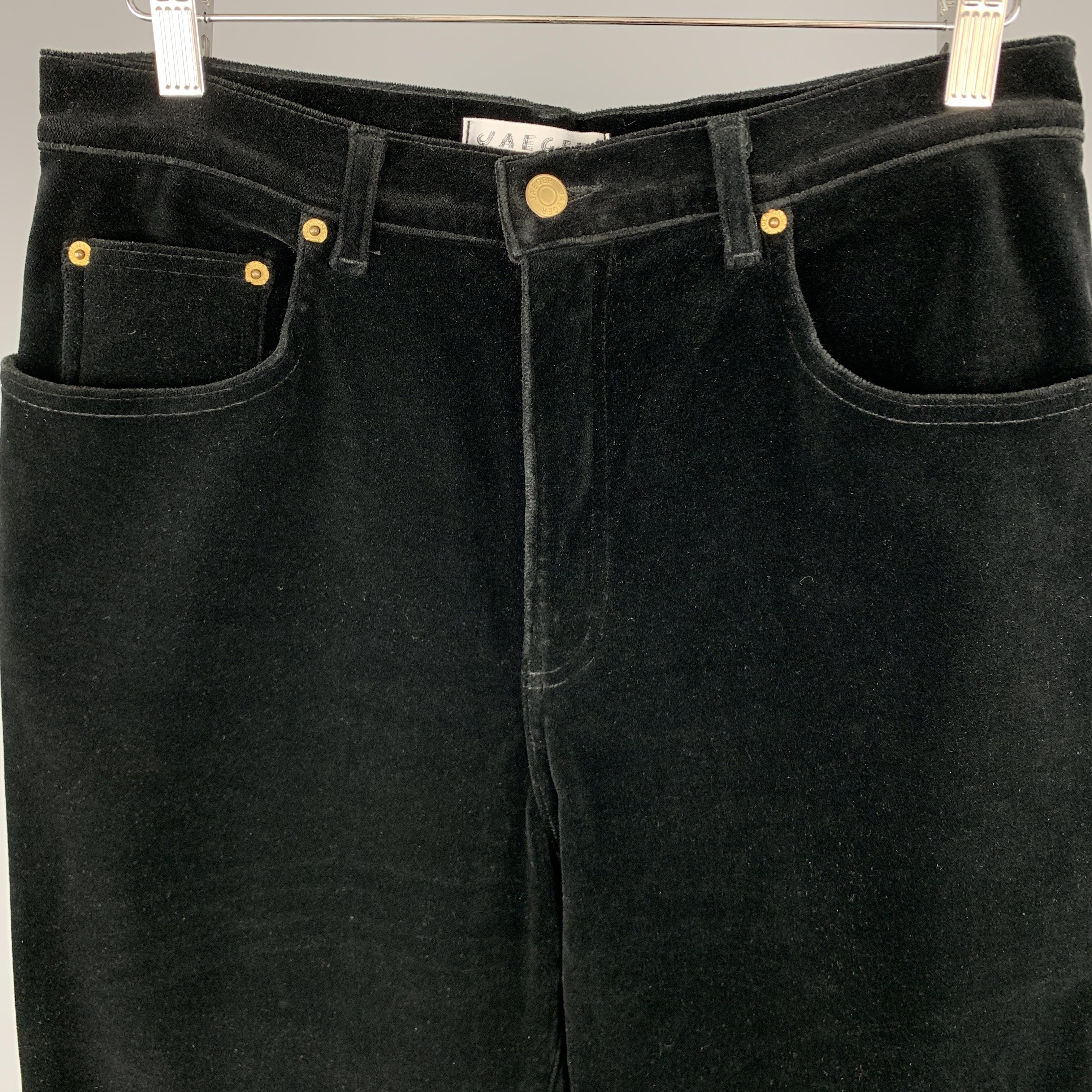 JAEGER pants come in black stretch velvet in a classic five pocket cut. Made in France.

Excellent Pre-Owned Condition.
Marked: US 12

Measurements:

Waist: 32 in.
Rise: 13 in.
Inseam: 28 in.