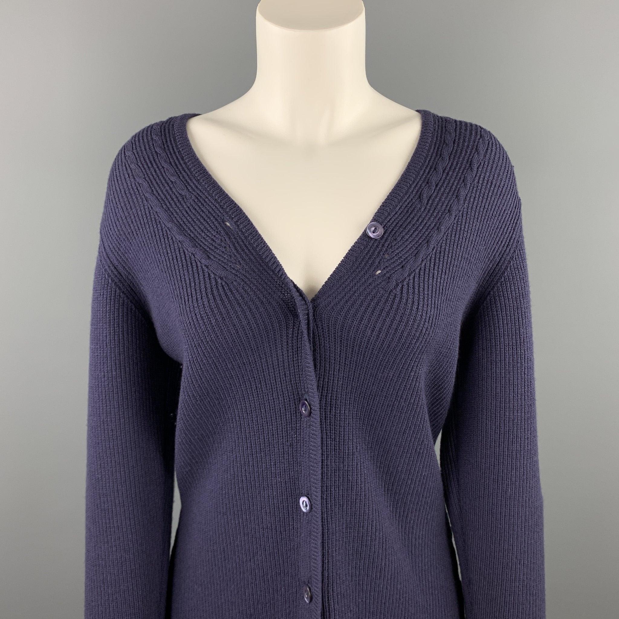 JAEGER cardigan comes in a navy ribbed merino wool featuring a buttoned closure. Made in England.Very Good
Pre-Owned Condition. 

Marked:   M 

Measurements: 
 
Shoulder: 15.5 inches 
Bust: 37 inches 
Sleeve: 26 inches 
Length:
25 inches 
  
  

