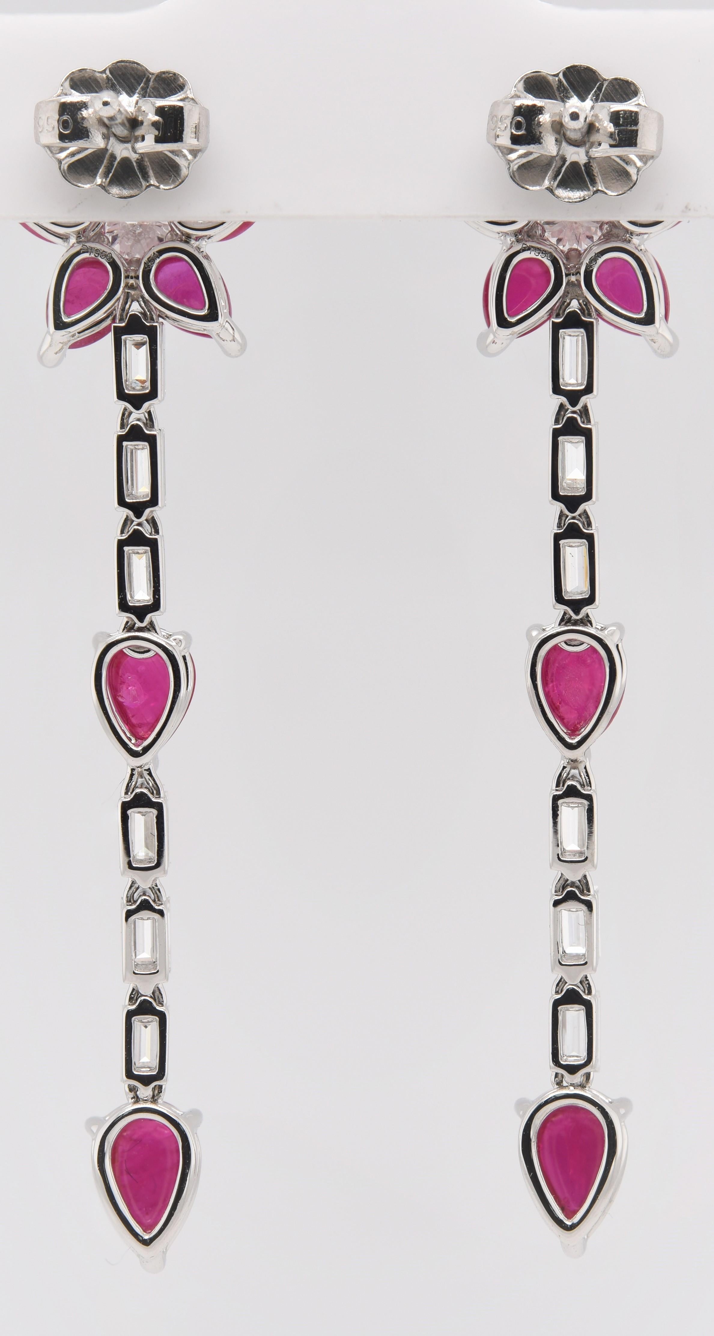 These Cabochon Ruby Earrings are designed as a flower and are surrounded with diamonds which drop to linear pear shaped cabochon rubies. With 4.20 carats in Rubies and 1.15 carats in Diamonds these earrings are 5.33 in total carat weight all mounted