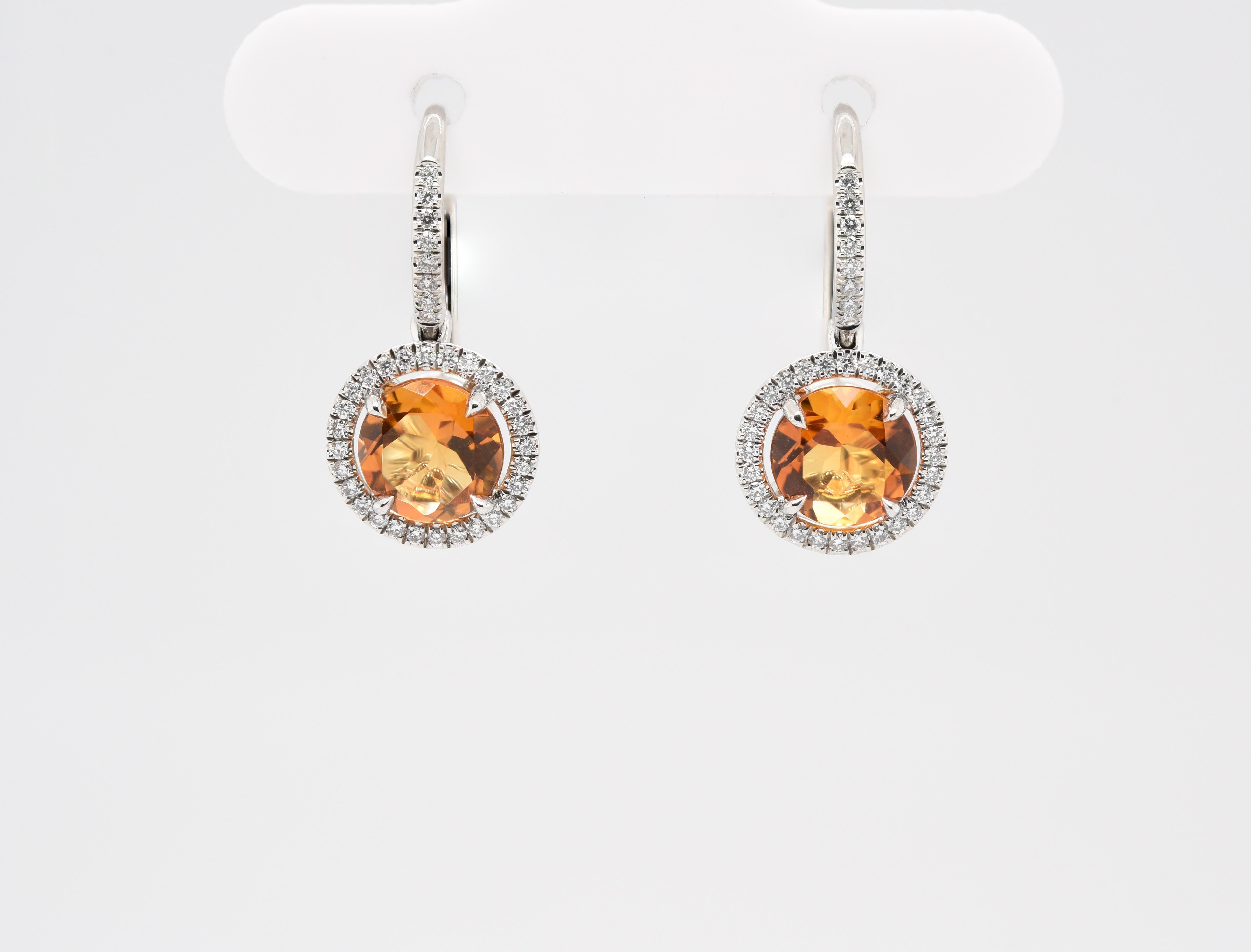 These Radiant Halo Yellow Citrine and Diamond Earrings have 1.5 carats of Yellow Citrine and 72 Diamonds all set in Platinum. 

At JAG New York we have been designing, manufacturing and guaranteeing our craftsmanship in New York since 1995!  Express