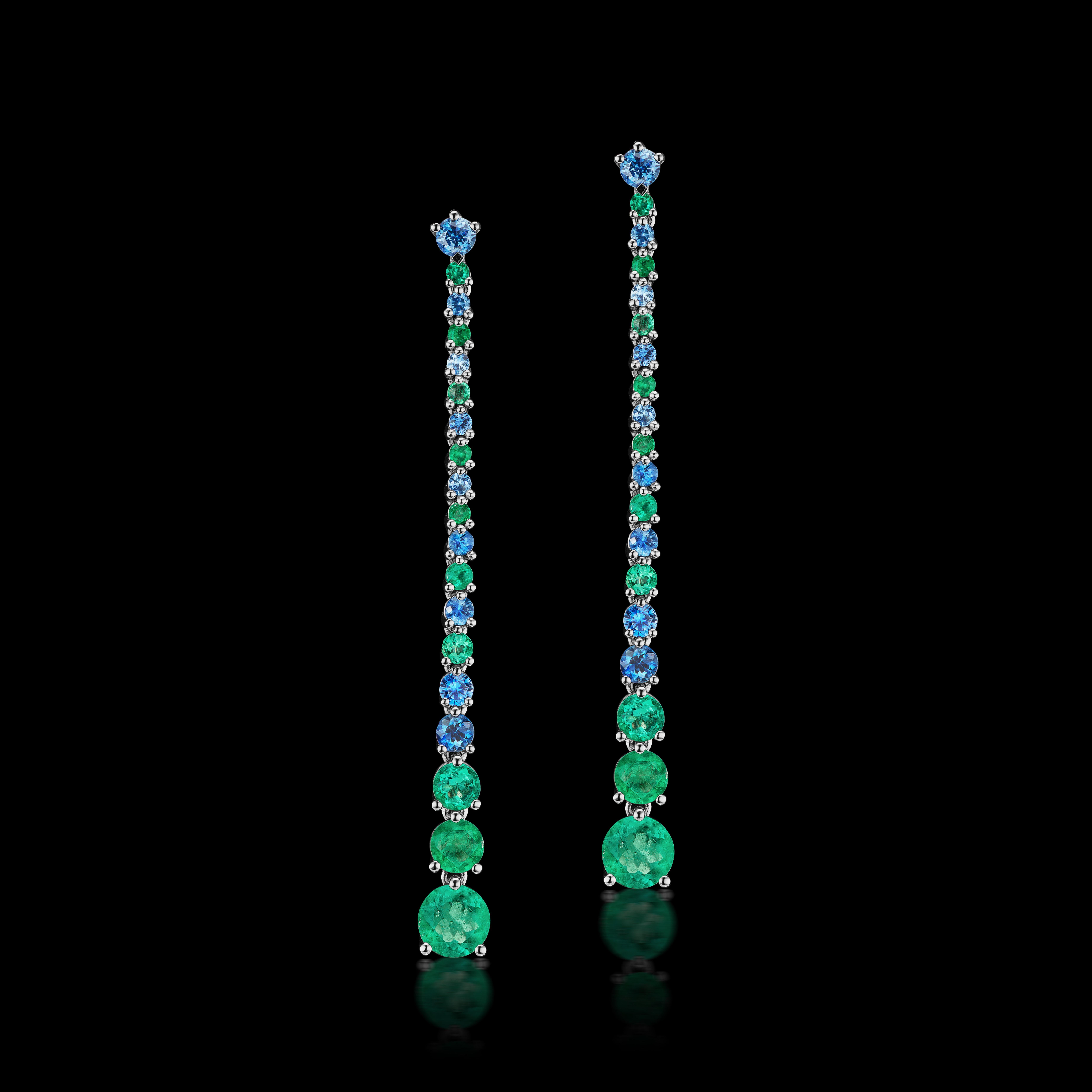 Alternating and graduating emeralds and sapphire drop earrings from our Vapour Collection with 5 grams of Platinum and  2.15 carats of genuine emeralds and sapphires. The gemstones are graduated and are 2 inches in length. 

