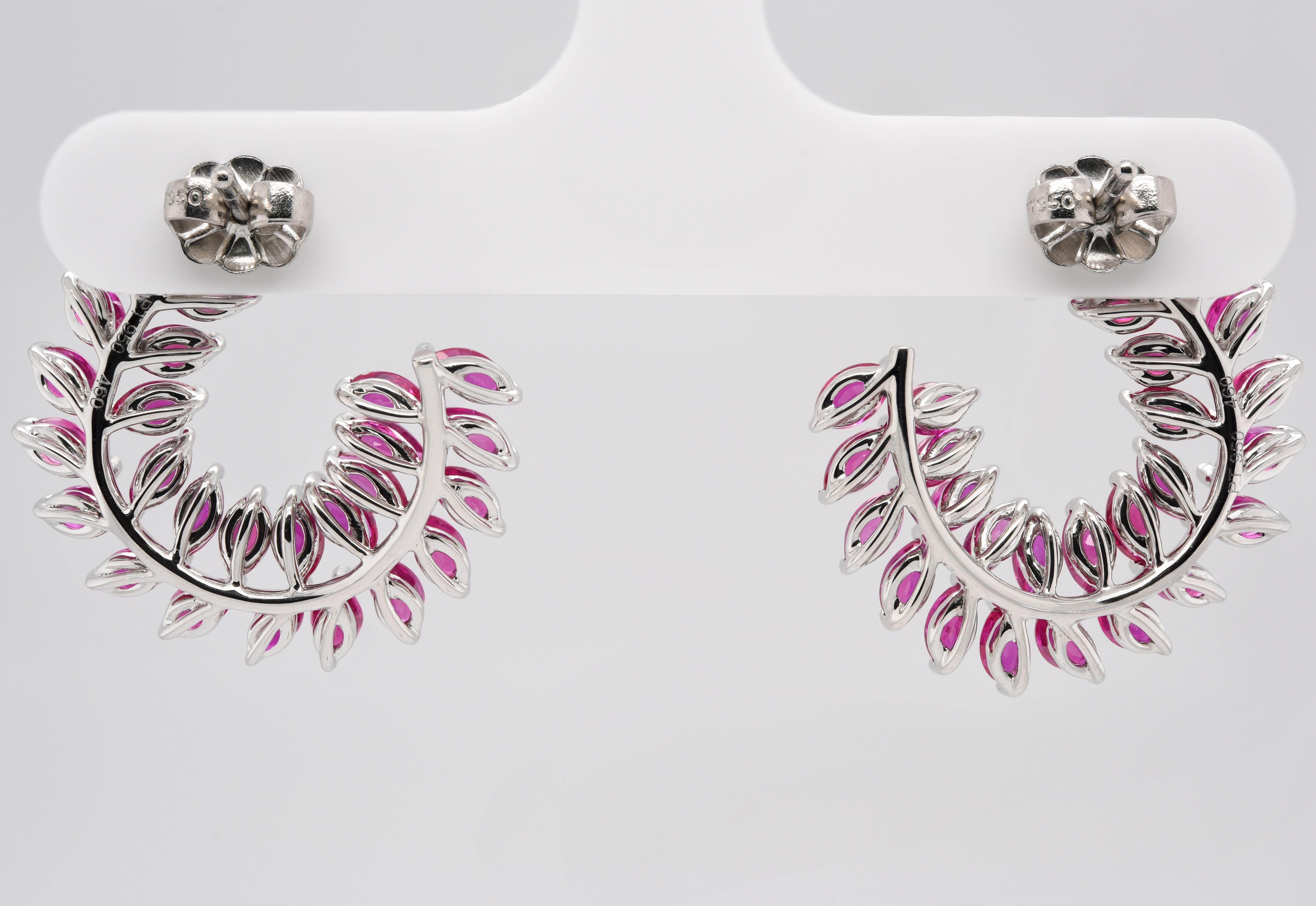  These are stunning circle leaf earrings made up of 6.75 carats of Rubies set in Platinum. 

At JAG New York we have been designing, manufacturing and guaranteeing our craftsmanship in New York since 1995!  Express yourself through jewelry! 
