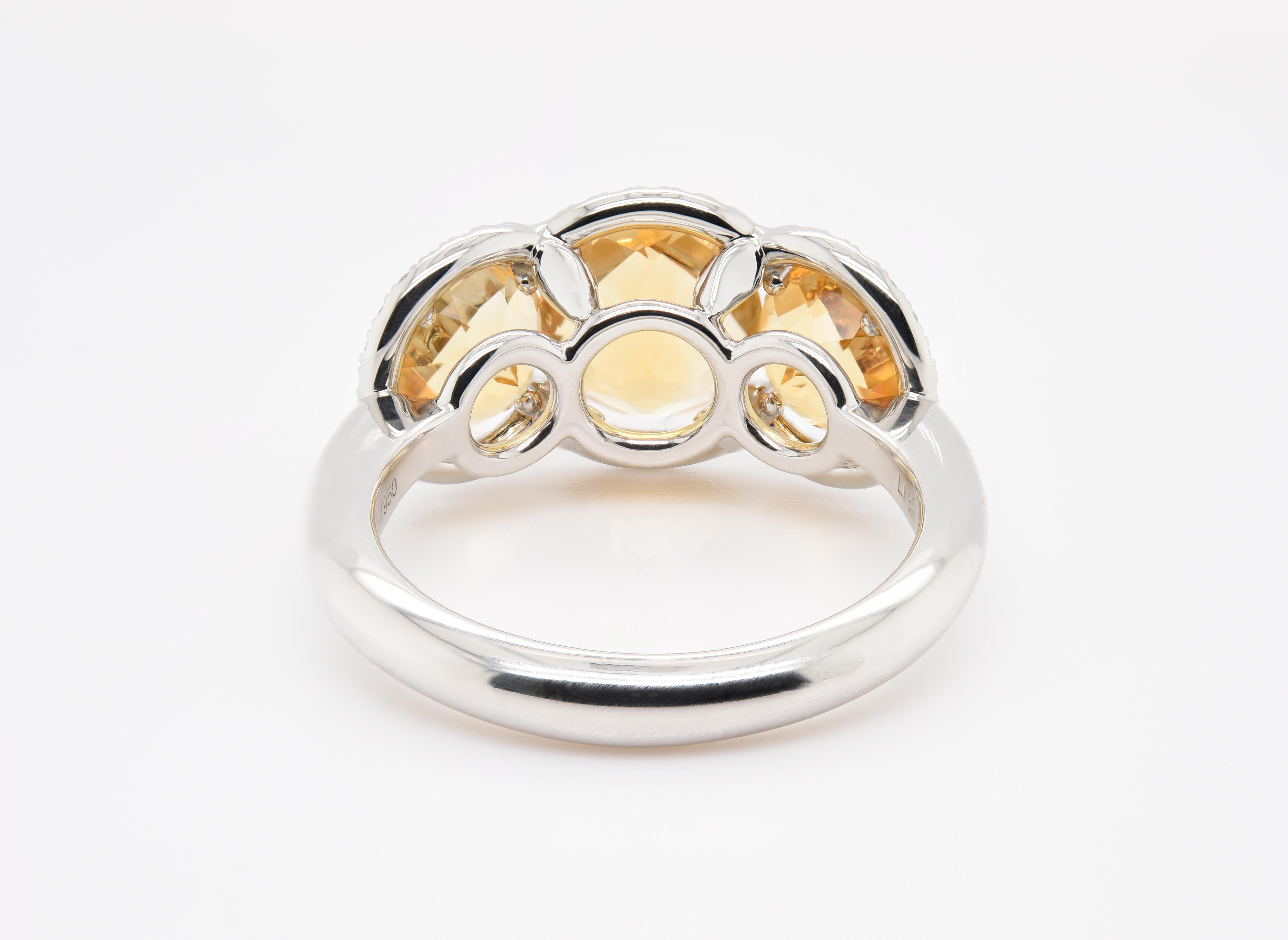 Round Cut JAG New York Three Citrine Surrounded by Diamond Halos Ring in Platinum For Sale