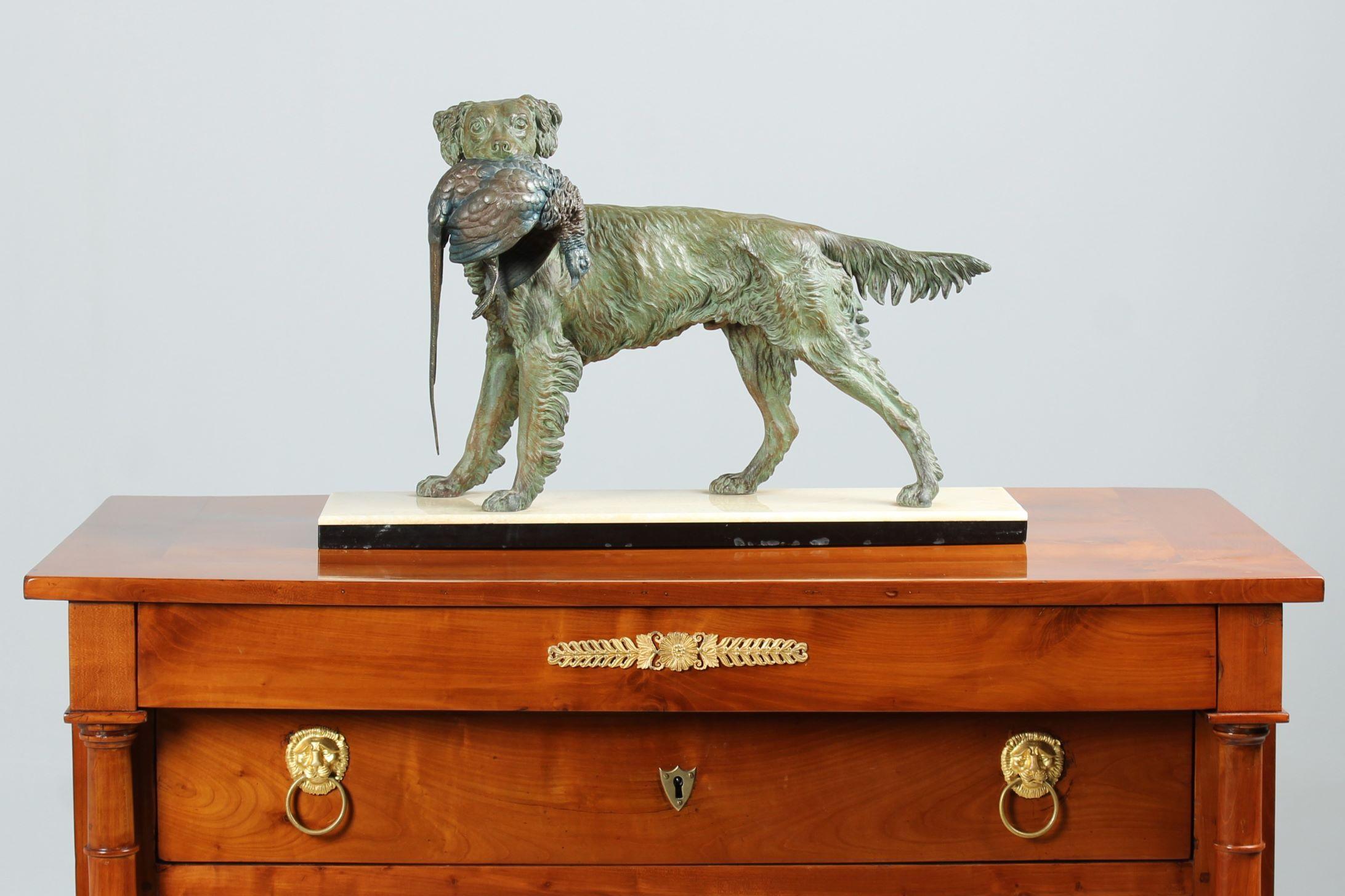 Hunting dog with pheasant from the early 20th century.
Based on a design by Jules Moigniez from the 1860s. 

Large version measuring H x W x D: 41 x 65 x 18 cm.

Realistic and lifelike depiction of a spaniel retrieving a pheasant. 
Made of cast zinc