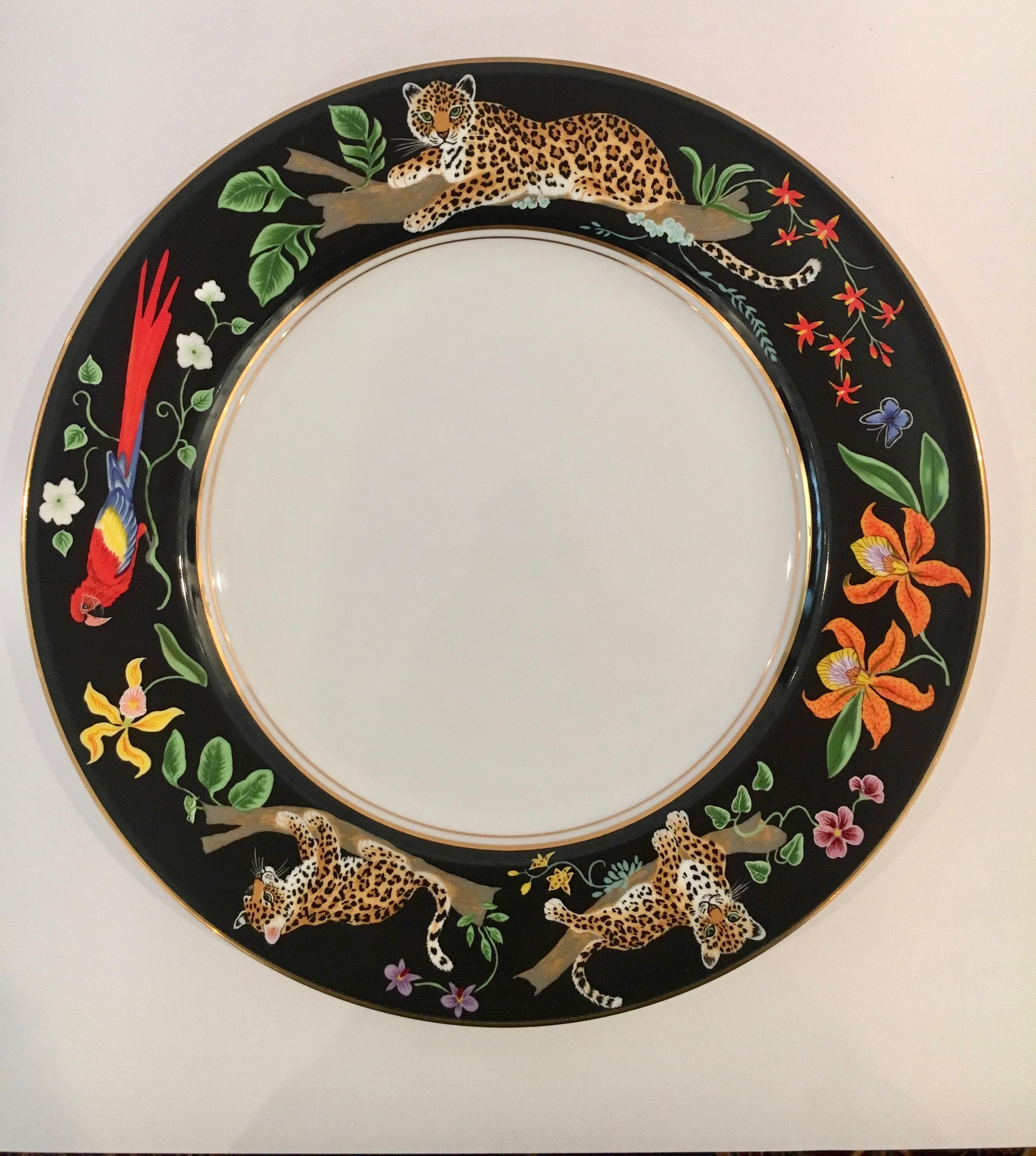 Lynn Chase 12 piece place setting with additional pieces, Jaguar Jungle in porcelain with 24 carat gold hand-painted accents.
12 - 12” dinner plates
12 - 8.25” salad plates
11 - 2.25”h x 3”diameter cups
12 - 5.5” saucers
12 - 9.25” large rim