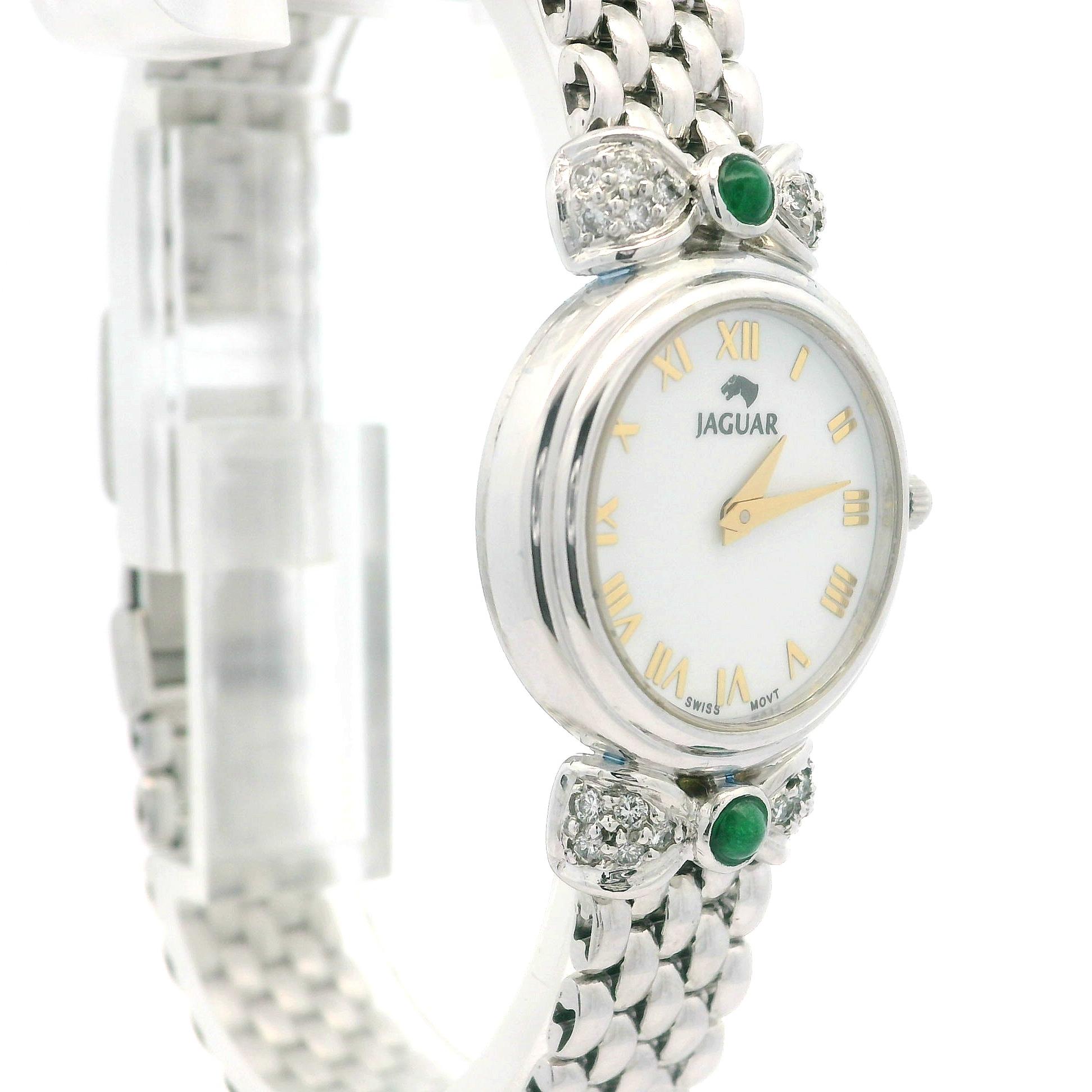 --Stone(s):--
(20) Natural Genuine Diamonds - Round Brilliant Cut - Pave Set - 0.30ctw
(2) Natural Genuine Emeralds - Round Cabochon Cut - Bezel Set - Deep Green Color - 3mm

Case Material: Solid Platinum
Case Diameter: 22mm
Case Height: 31.7mm