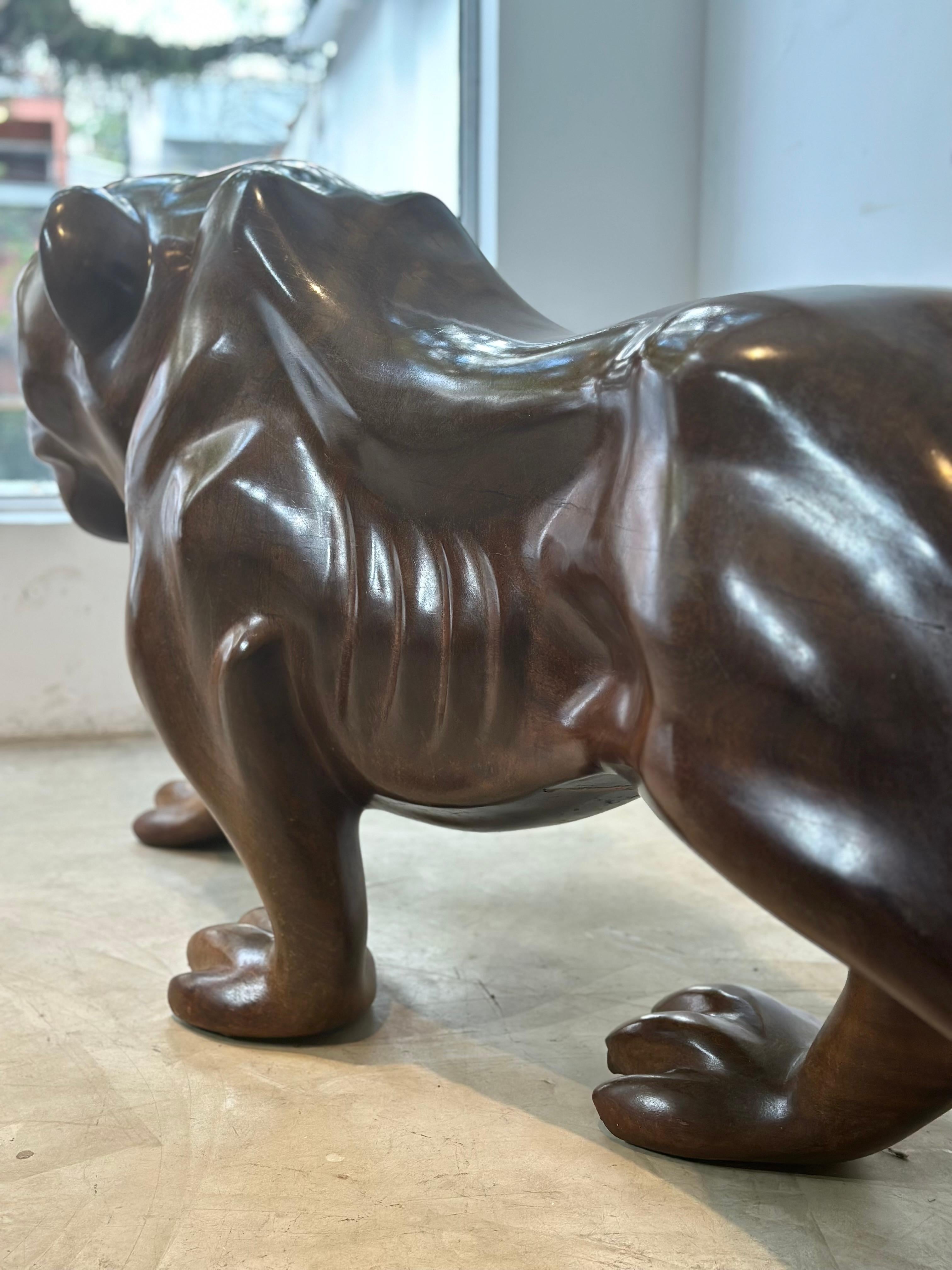 Impressive sculpture of a female Brazilian jaguar made in a huge single wood block. This piece was exceptionally well-executed, made in the 1930/1940's and is in an excellent conservation condition. This is a modern sculptural masterpiece albeit it