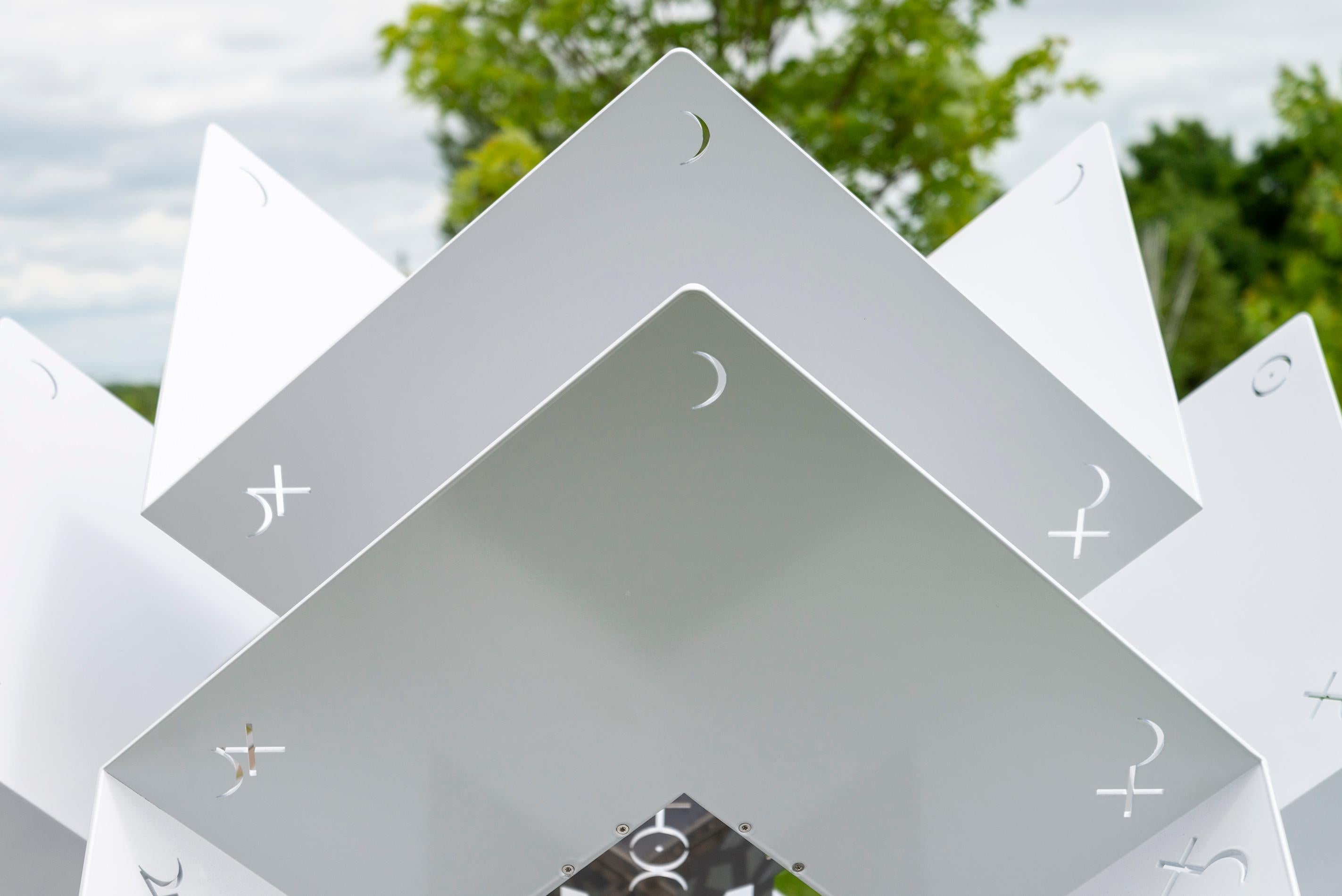 The powerful architectural form of this contemporary sculpture was created by Jah Qube—a collaboration between Toronto-based artist Javid Jah and Alex Akbari, a masterful fabricator. The dynamic, geometric shape forged from polished stainless steel