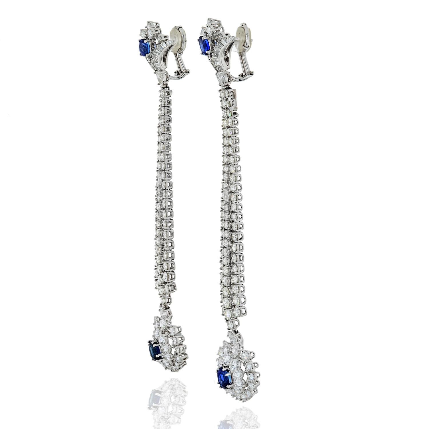 Elevate your evening look with these exquisite 18K white gold earrings, a true embodiment of elegance and sophistication. Measuring approximately 4.5 inches in length, these earrings are designed to make a statement and capture the essence of