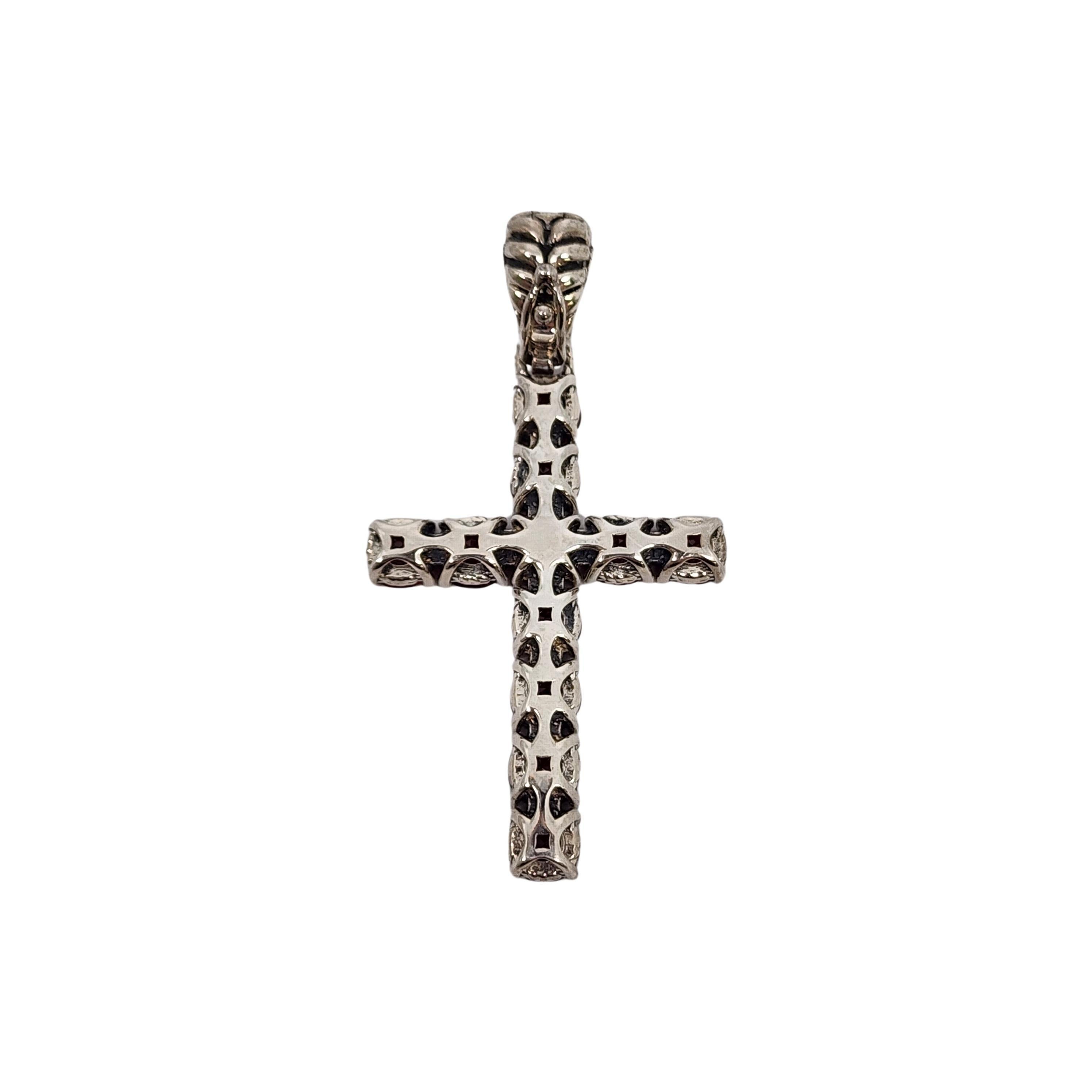JAI by John Hardy sterling silver garnet cross enhancer pendant.

From the affordable line JAI by John Hardy for QVC, this cross pendant features round prong set red garnet stones and a basket weave textured bail that opens and is secured closed