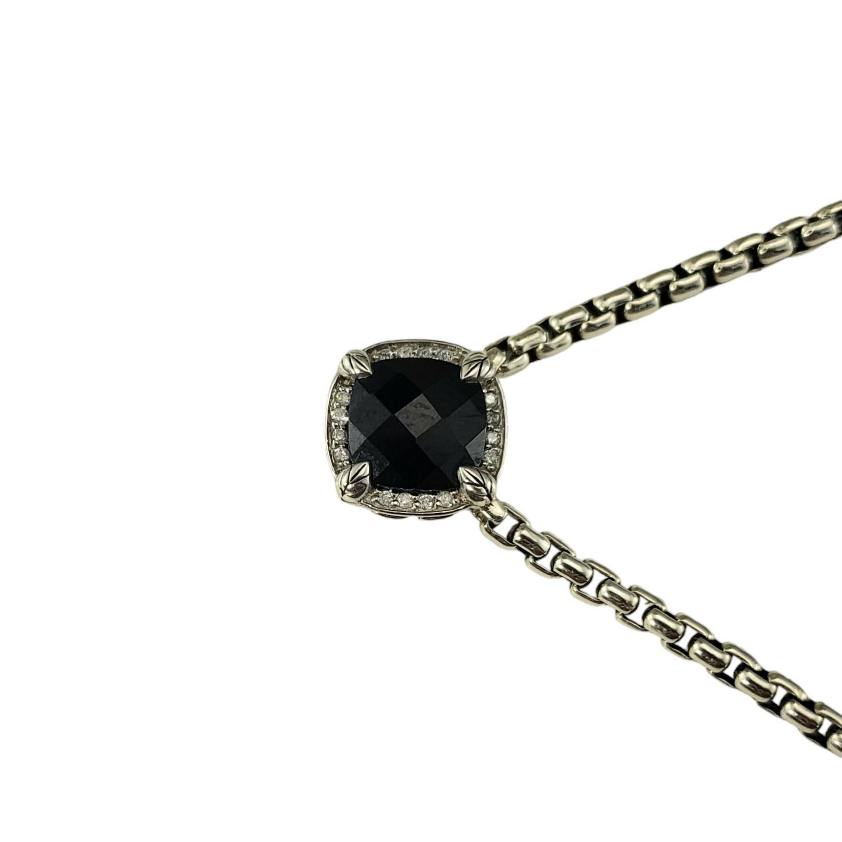 John Hardy Sterling Silver Onyx and Diamond Pendant Necklace

This lovely pendant necklace by John Hardy features one black faceted onyx stone surround by 16 round brilliant cut diamonds.

Hallmark: JAI 925 THAILAND

Size: 16.5