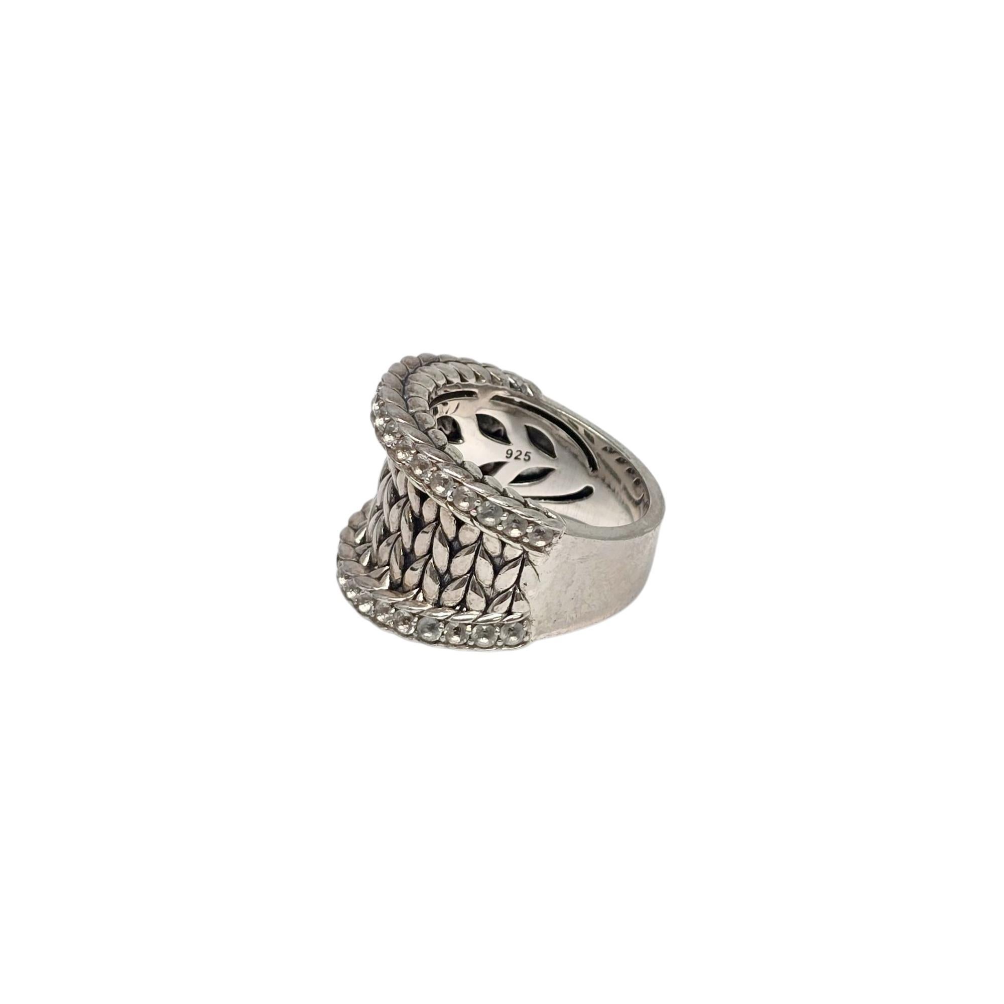 JAI Sterling Silver Pave White Topaz Basketweave Saddle Ring.

Size 8

A beautiful wide ring featuring a basket weave design with pave set clear round white topaz stones.

Measures approx 5/8