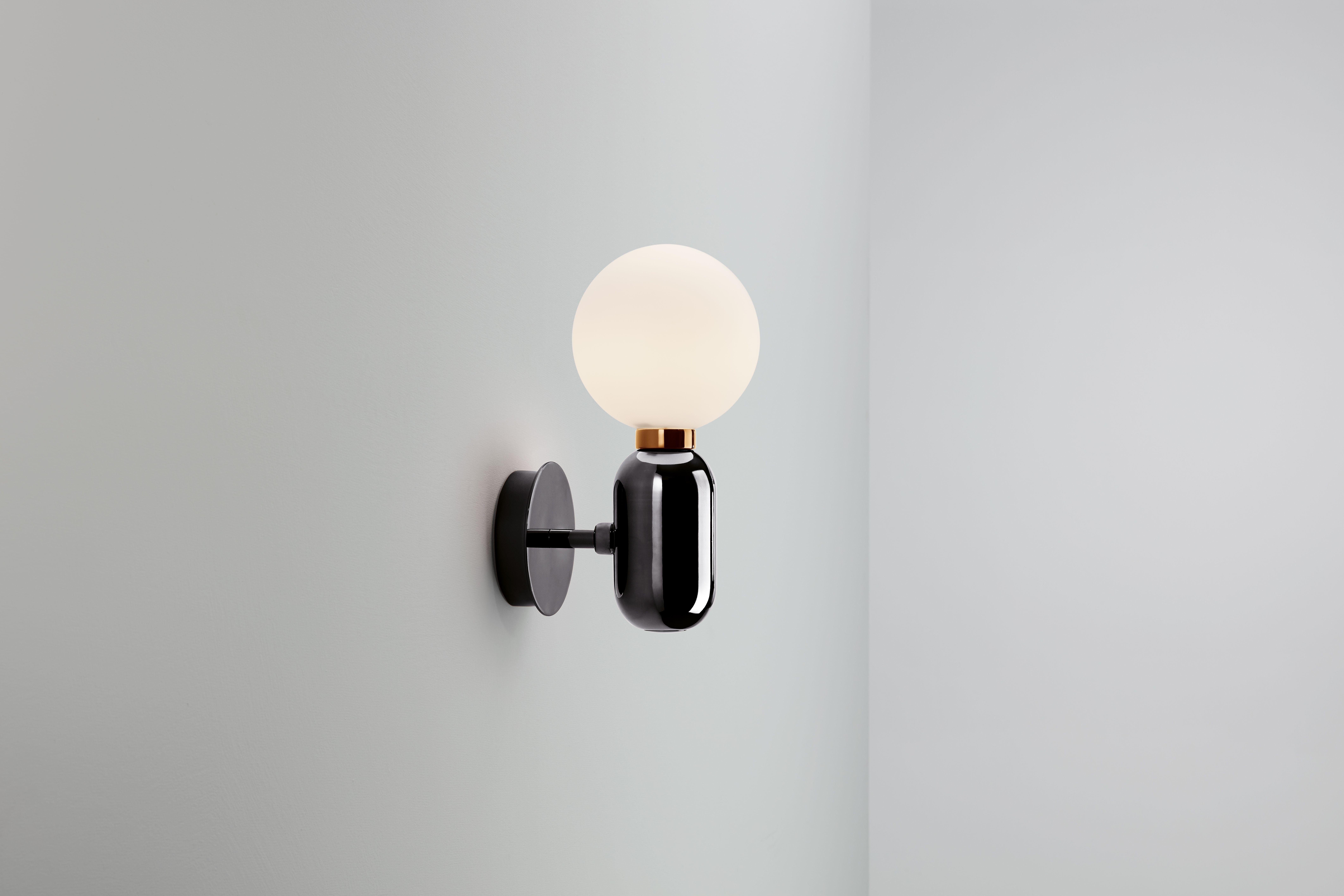 Wall Lamp, model Aballs A, designed by Jaime Hayon in 2013.
Manufactured by Parachilna.
Handmade ceramic black body and blown opal matt glass diffuser.
Base is also available in white, golden, copper or platinum ceramic.

Shiny and eye-catching