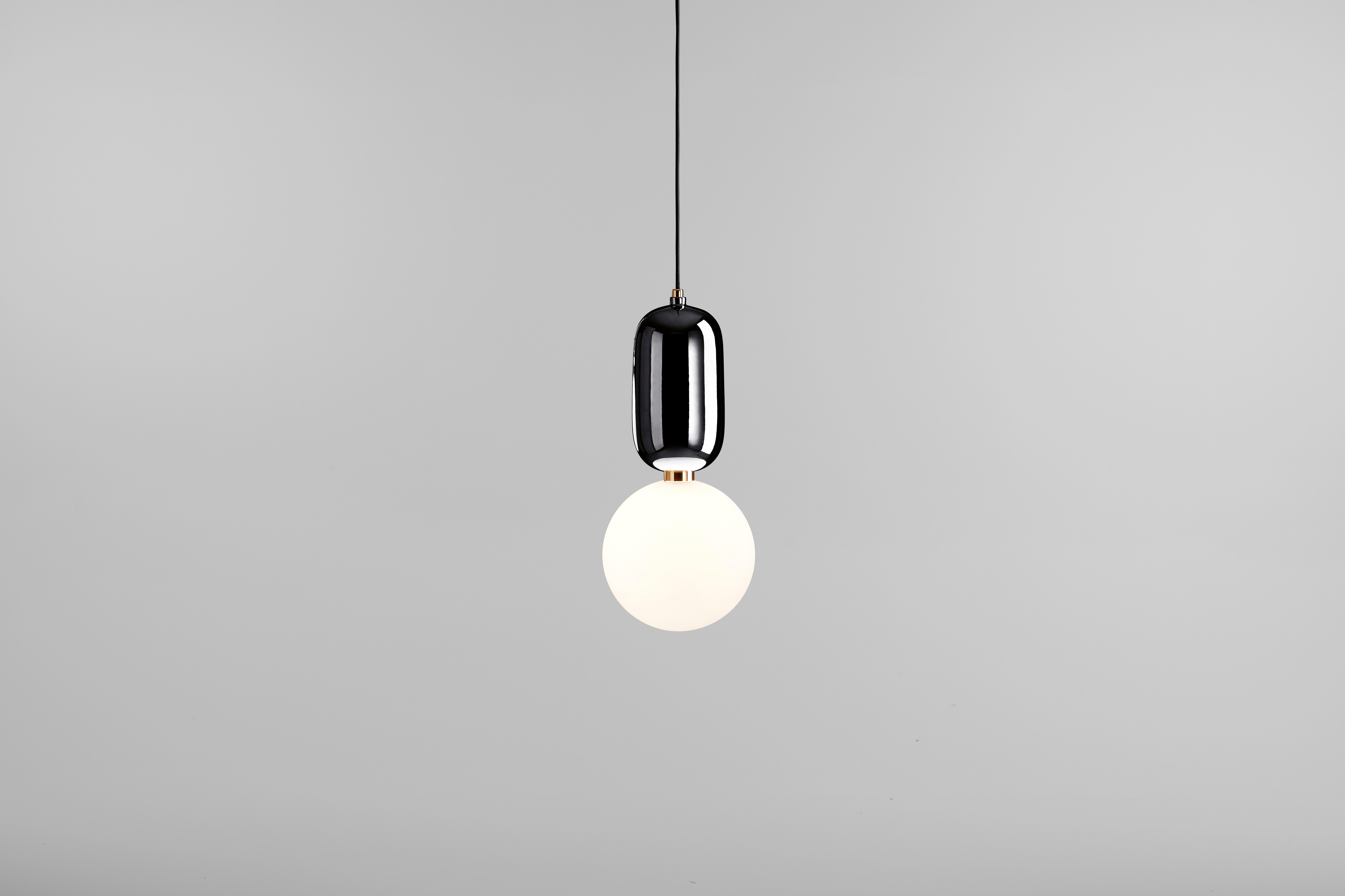 Suspension lamp, model Aballs T ME, designed by Jaime Hayon in 2013.
Manufactured by Parachilna.
Handmade ceramic body and blown opal matt glass diffuser. 
Base is also available in white, black, golden, copper or platinum ceramic. 


Shiny and