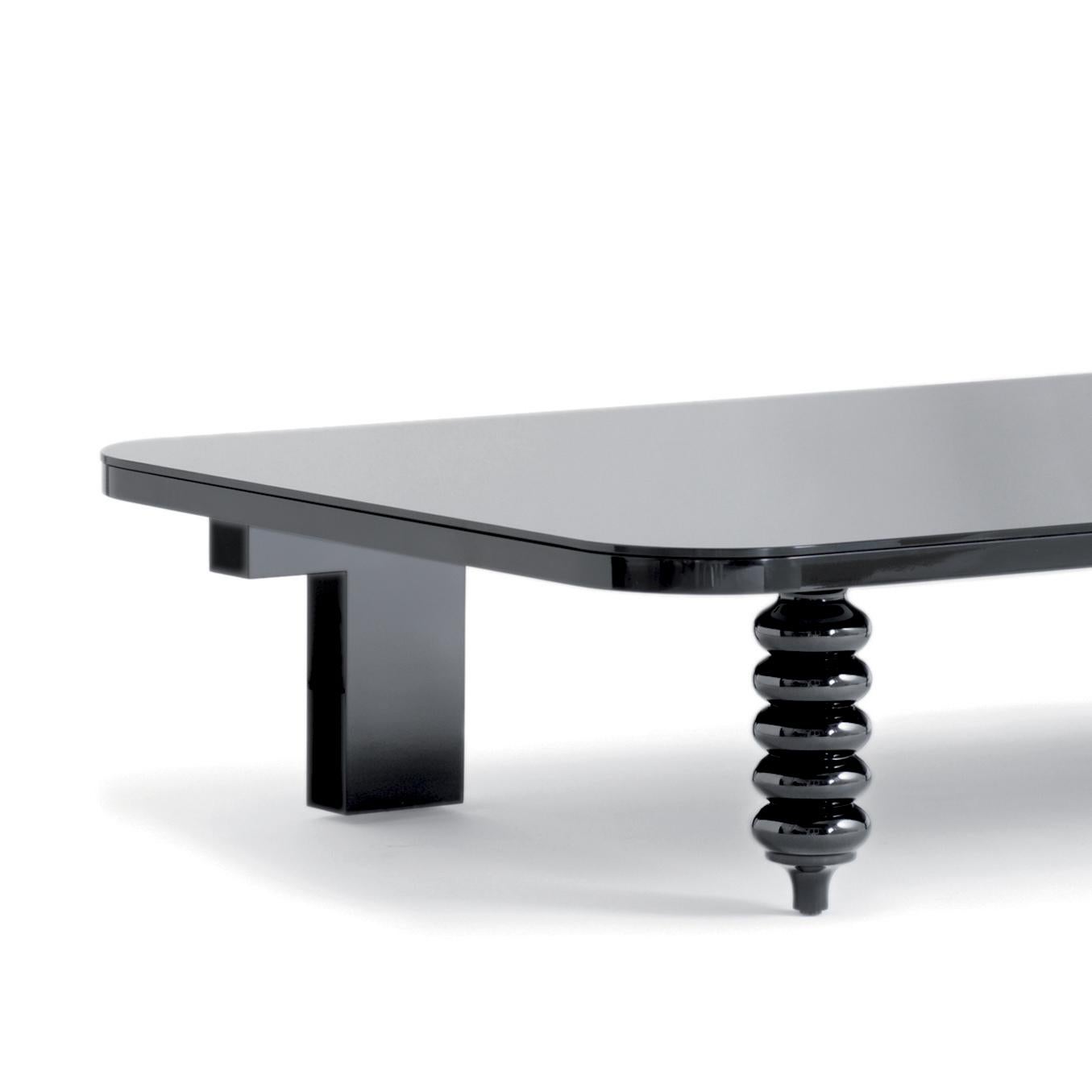 Low table designed by Jaime Hayon.
Manufactured by BD Barcelona Design.

MDF base and legs in turned solid alder wood, lacquered in black gloss 

Meaasures: 100 x 160 x 35 cm.