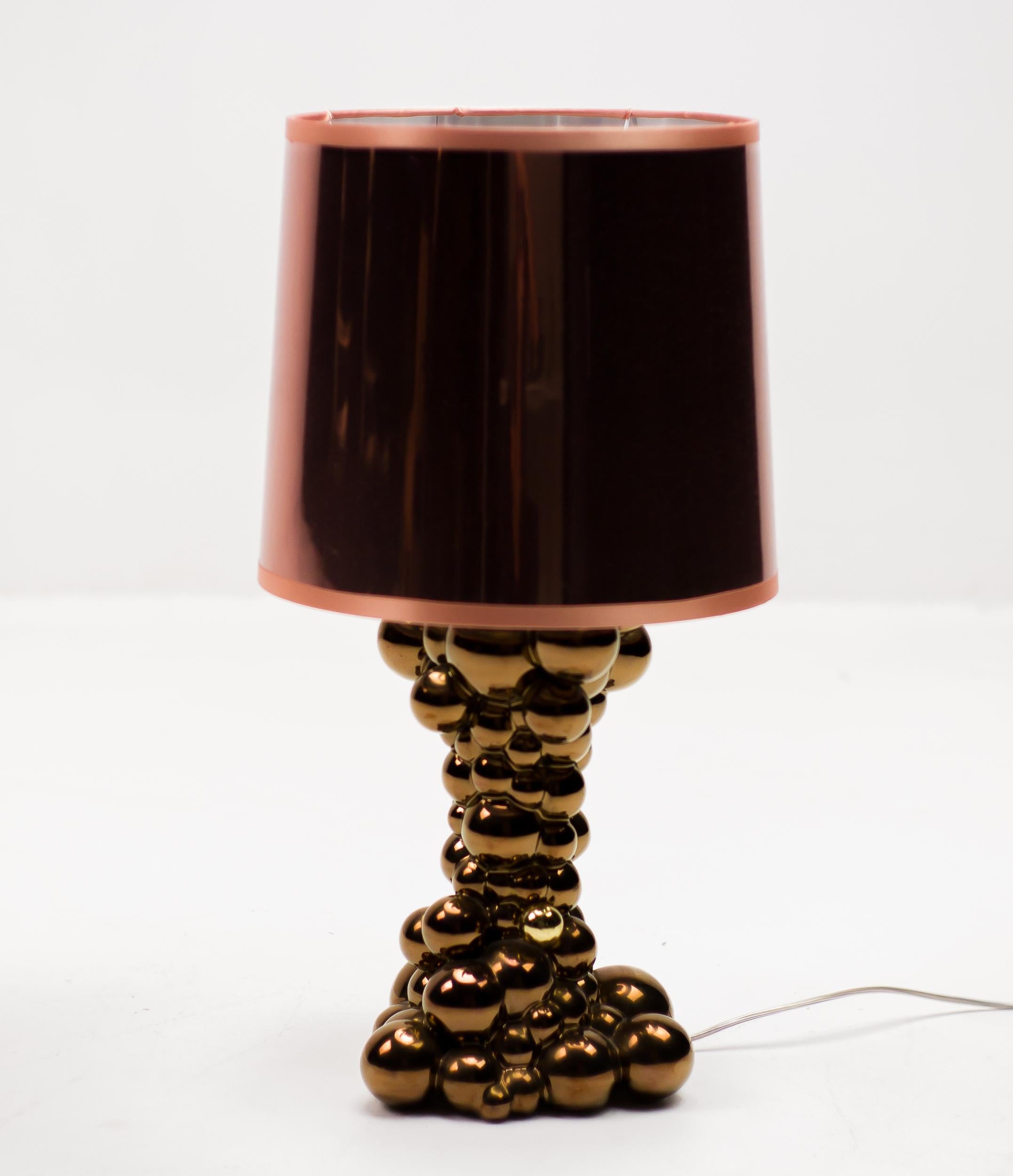 Rare Bubbles table lamp in glossy copper ceramic designed by Jaime Hayon for Bosa. 
The bubbles lamp evokes the effervescent effect of a flurry of bubbles. The material that is transformed by a touch and a body that fills with light. To achieve the