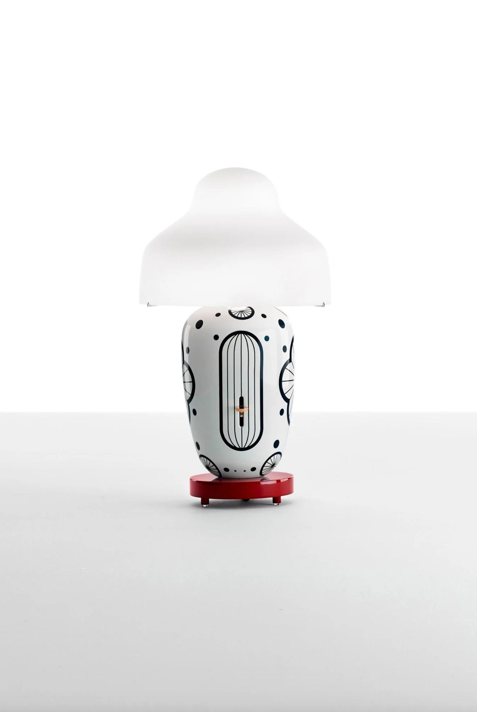 Jaime Hayon Chinoz Ming - Burgundy Base White Matte Table Lamp For Parachilna 

Asian inspired table lamp. Consisting of a mouth-blown diffuser, ceramic body and a lacquered wooden base. The design invites for color and finish combinations.

Product