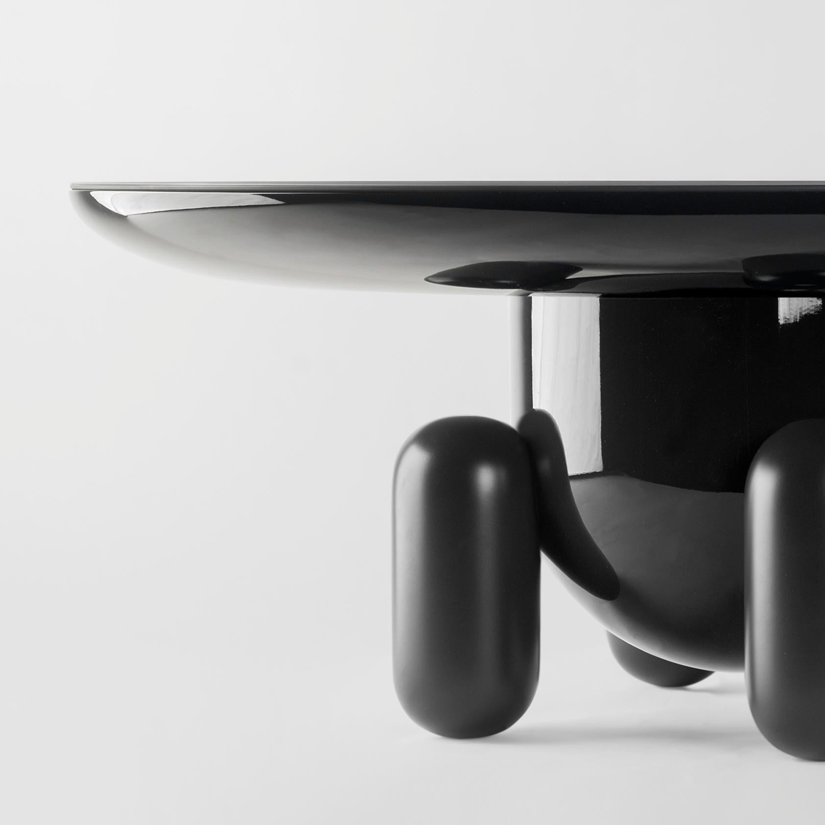 Dark grey explorer #03 table

Design by Jaime Hayon, 2019
Manufactured by BD Barcelona.

Laquered fibreglass body. Solid turned wooden legs and lacquered. Painted glass tabletop.

Measures: 100 Ø x 42 cm

- Glass: Ral 7021
- Body: Ral 7021
