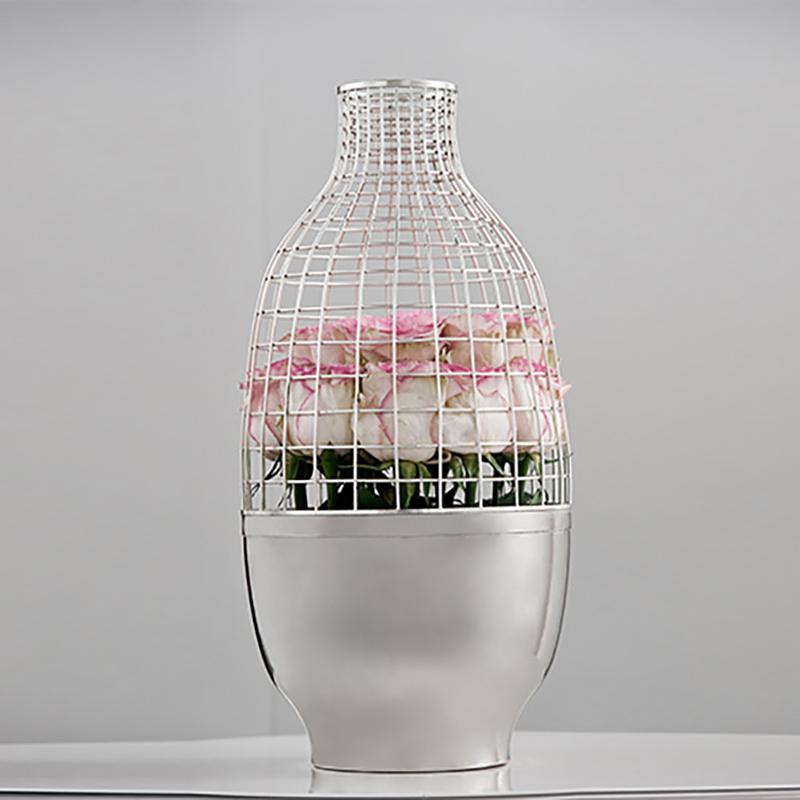 The Grid vase designed by Spanish designer Jaime Hayon and crafted in Turkey by Gaia & Gino. In two pieces, the grid top is fitted to the base and is lifted off. It can be used to showcase plants or flowers. Makes a large and dramatic centerpiece.