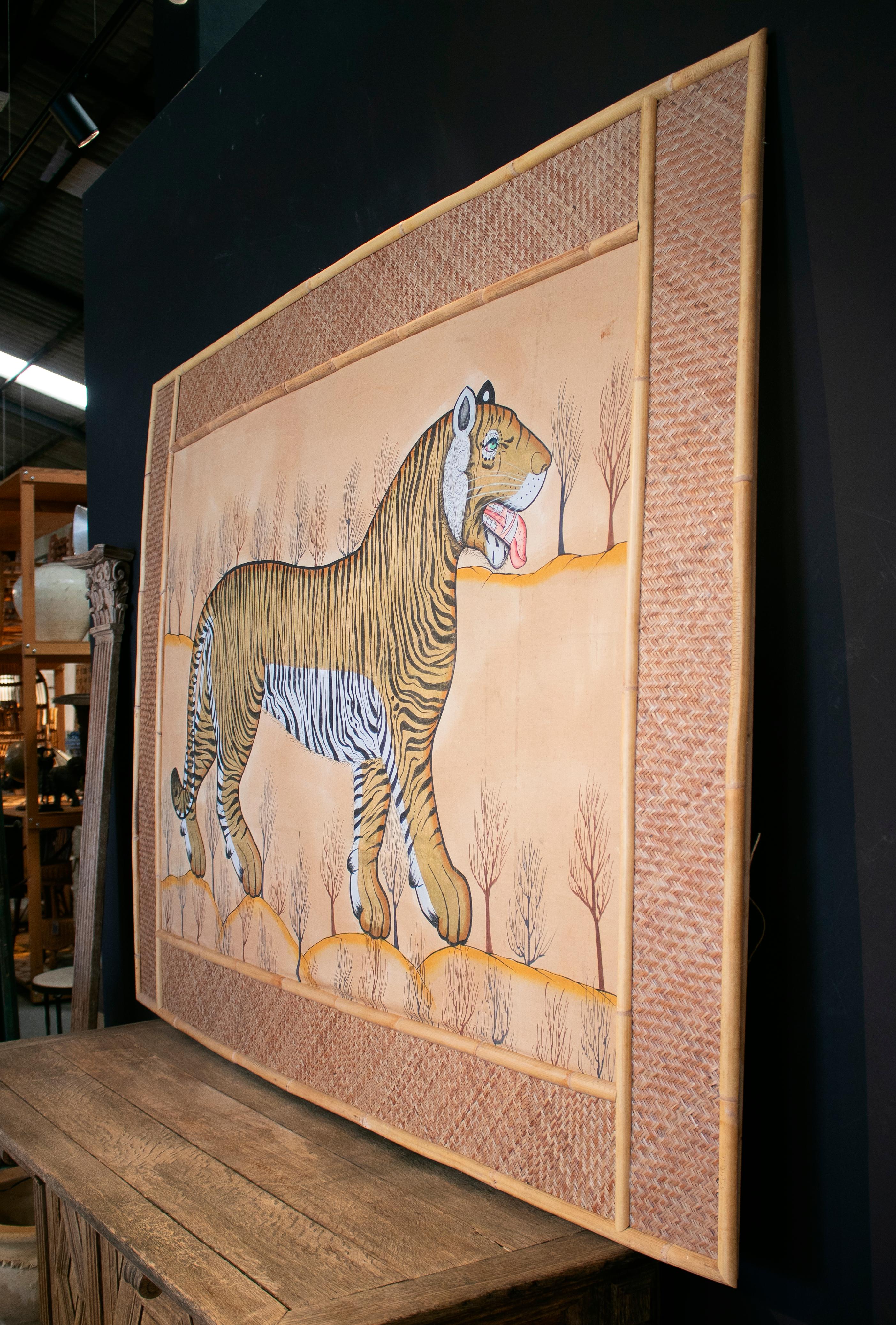 Jaime Parlade designed tiger hand drawn on fabric and framed in bamboo and woven Indian straw. 


 