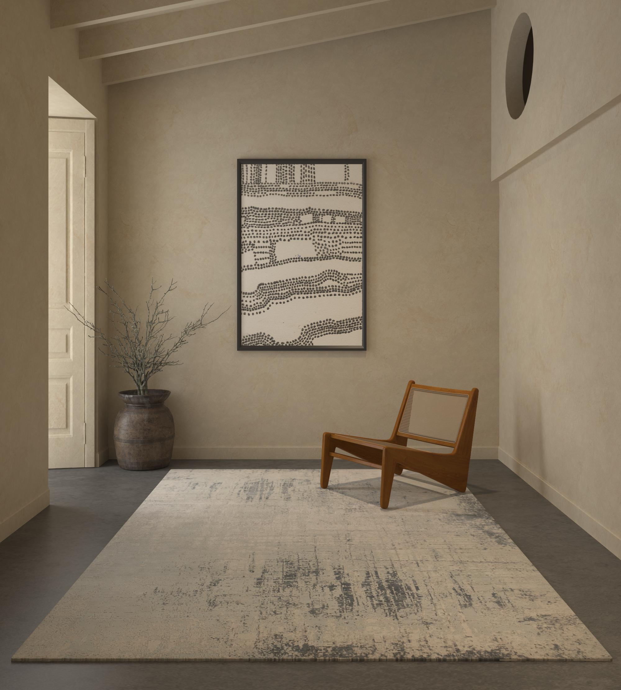 Laissez-vous séduire par l'art de notre tapis noué à la main, une fusion de blanc antique et de bleu pastel dans un design moderne. Inspiré par les motifs observés à la lueur des bougies, ce tapis raconte l'histoire d'une évolution constante grâce à