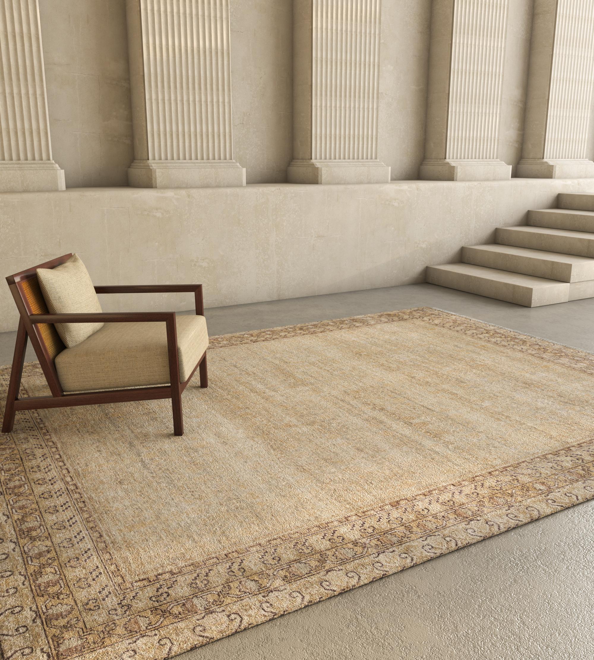 Explore the transformative magic of this hand-knotted rug that transcends conventional decor. Enveloped in a soothing tone-on-tone palette, it becomes an instant mood lifter for any space. Infusing warmth and comfort into your floors, this modern