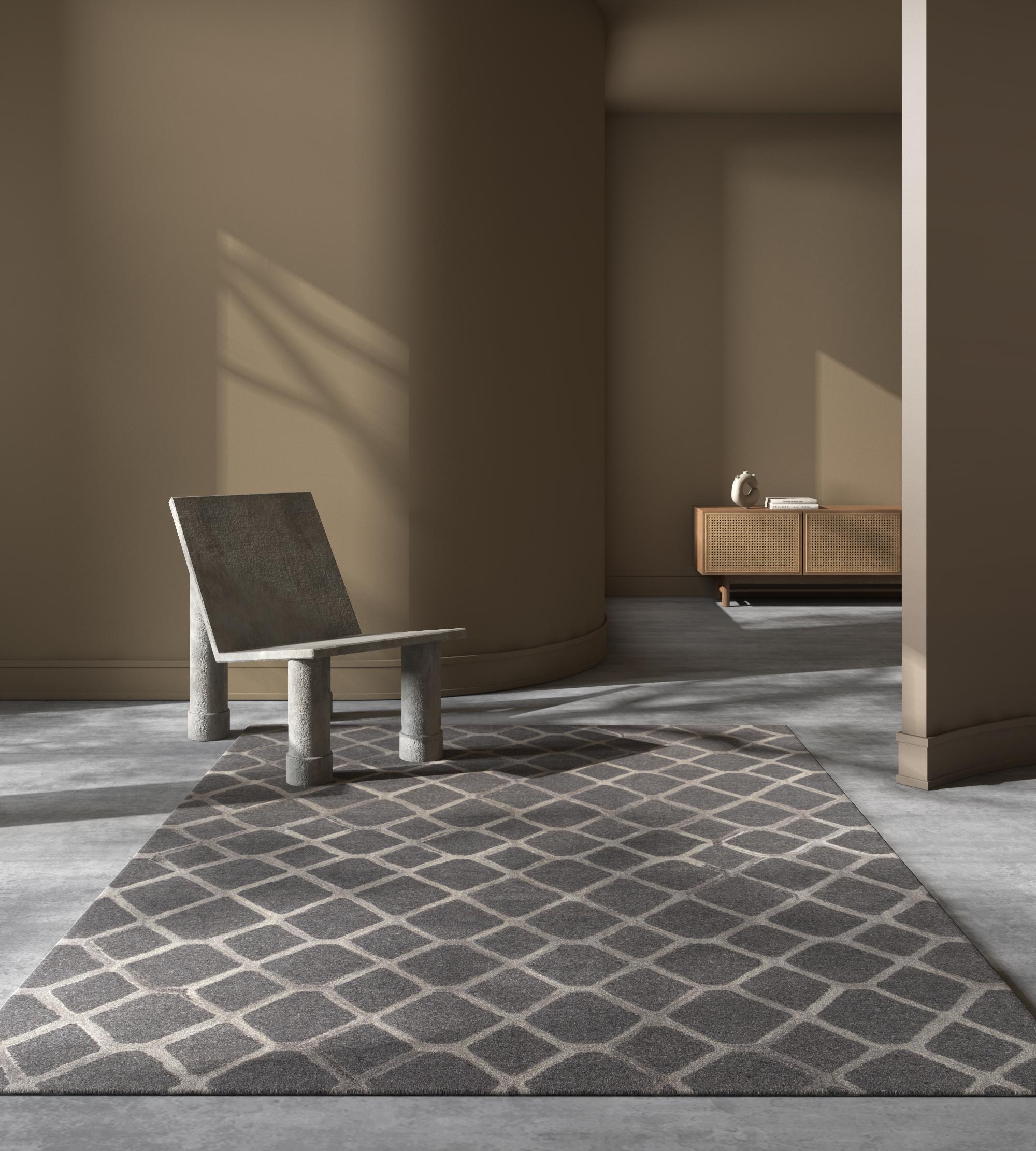 Delve into the timeless allure of this hand-tufted rug . Traditional patterns and motifs gracefully interweave with symmetric designs, creating a masterpiece that embodies a seamless blend of tradition and modernity. Muted colors and soft hues form