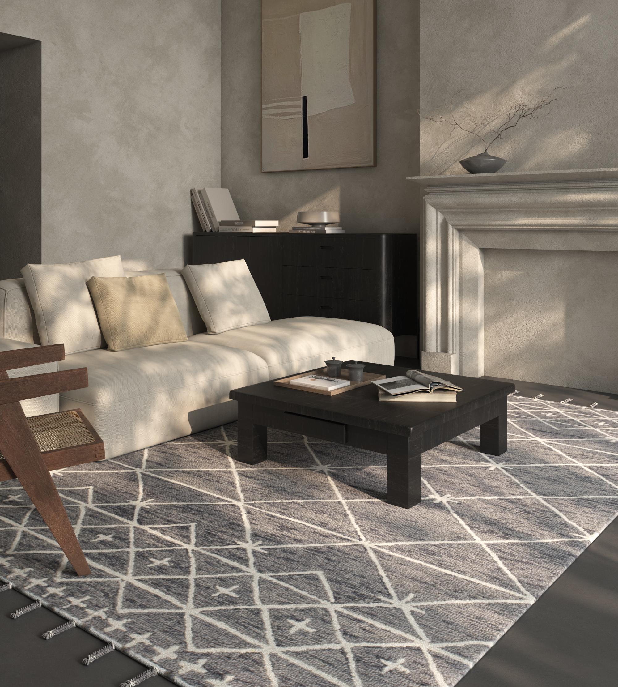 Embark on a visual journey with our Handtufted Rug, a captivating work of abstract art on a cloth canvas. Imagine it as the cityscape of your floor, where the Ebony Slate ground color seamlessly blends with the Natural White border. This masterpiece
