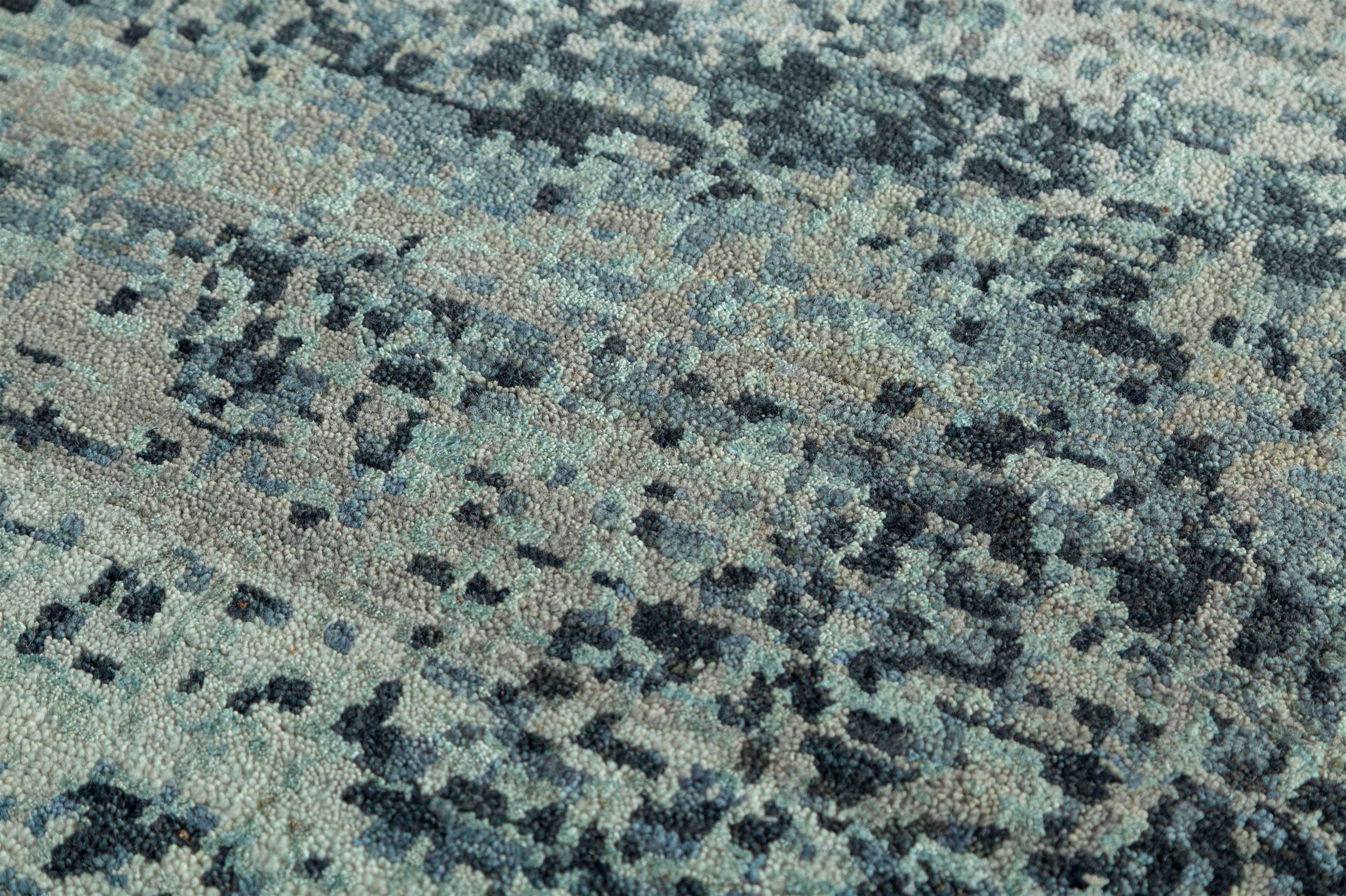 Explore modern designs for a contemporary space with the opulent Uvenuti collection. A collection of mesh textures and abstract designs, Uvenuti weaves a calm atmosphere with on-trend blues, saturated grays, and earth hues of white. Knotted to