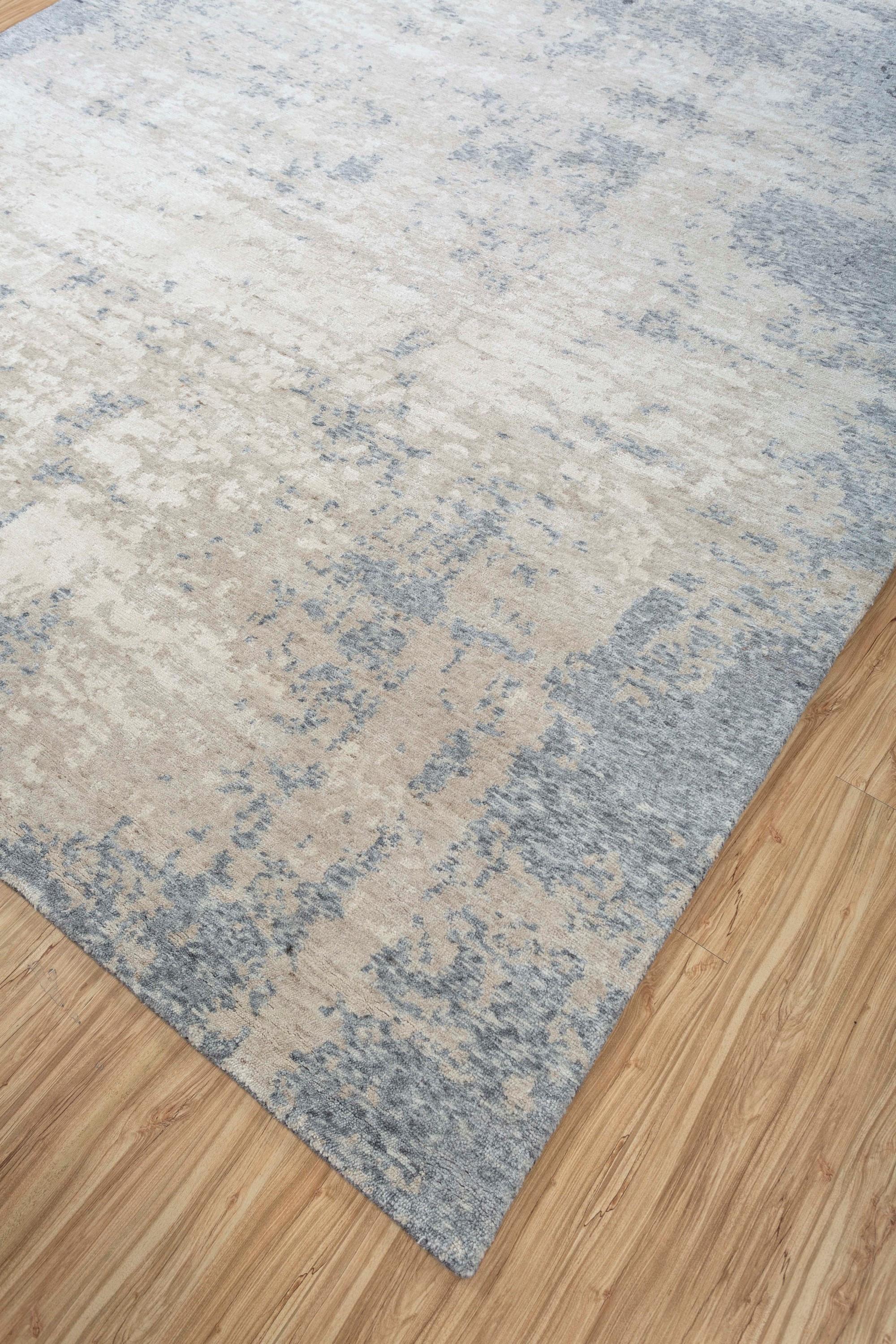 Explore modern designs for a contemporary space with the opulent Uvenuti collection. A collection of mesh textures and abstract designs, Uvenuti weaves a calm atmosphere with on-trend blues, saturated grays, and earth hues of white. Knotted to