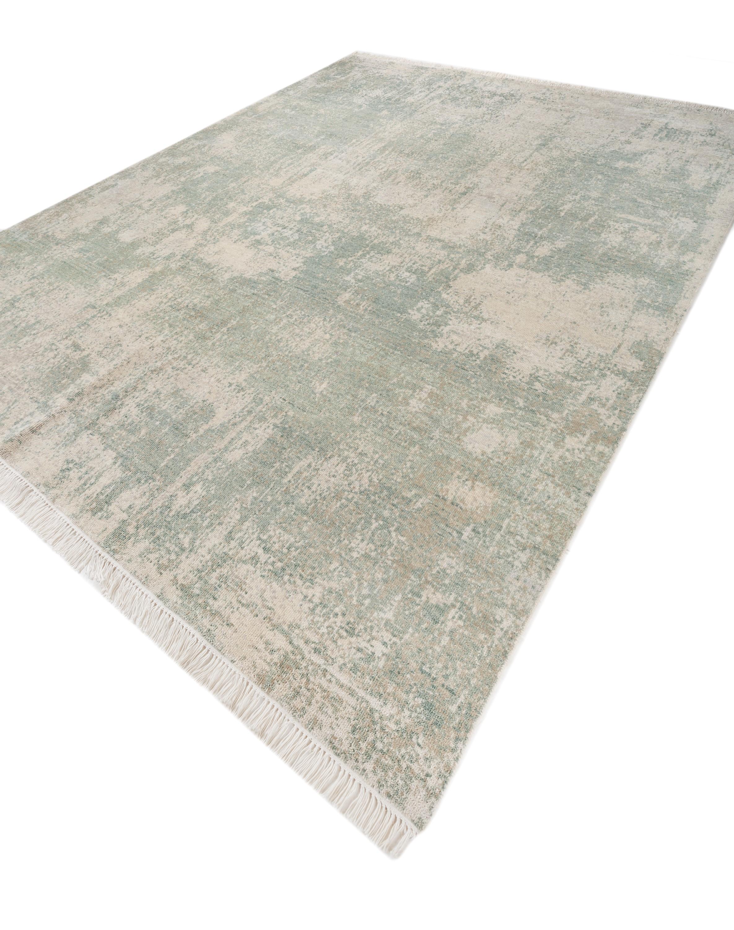 Explore modern designs for a contemporary space with the opulent Uvenuti collection. A collection of mesh textures and abstract designs, Uvenuti weaves a calm atmosphere with on-trend blues, saturated grays, and earth hues of white. Knotted to