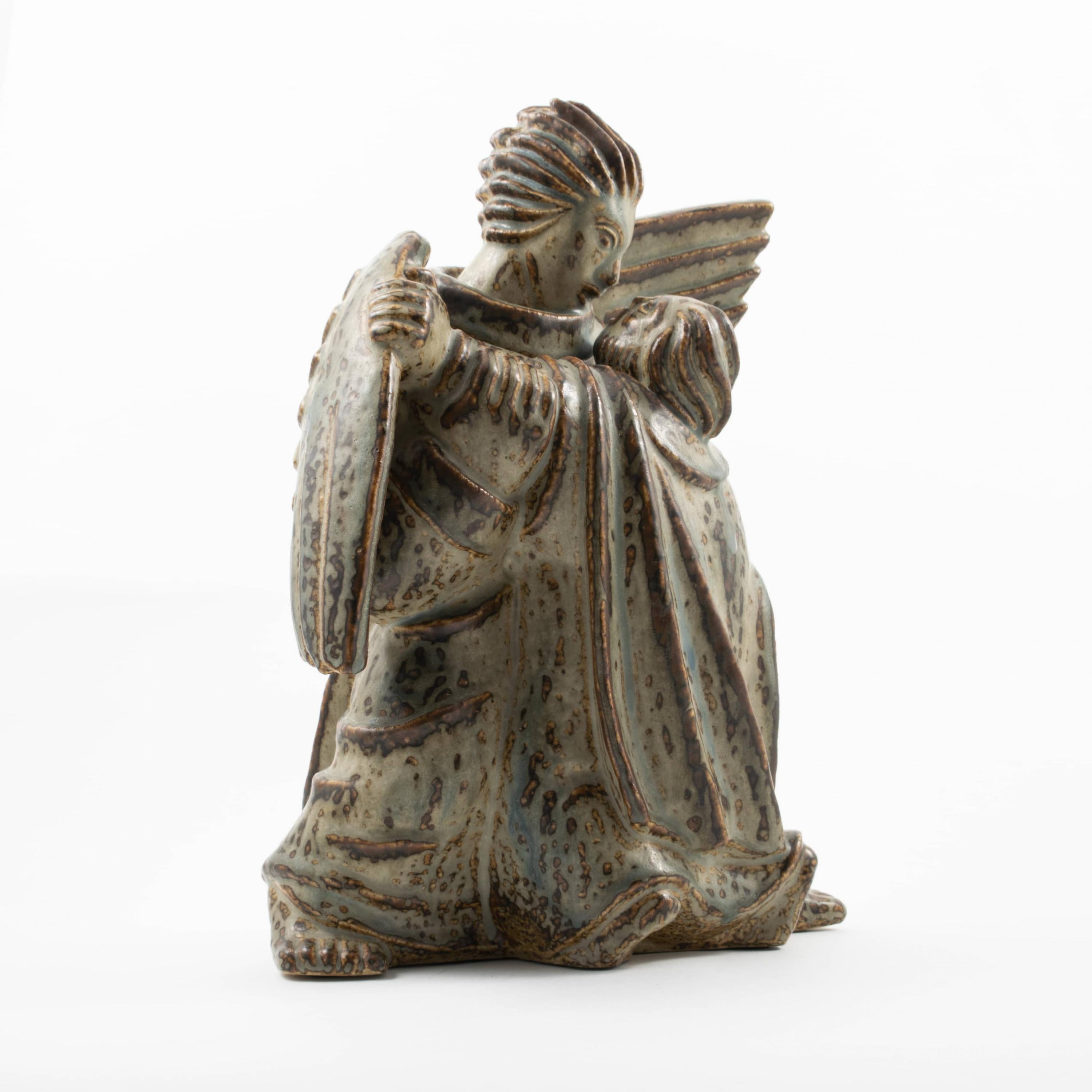 Jais Nielsen (1885-1961 ) for Royal Copenhagen.
'Jacobs Kamp med Englen' (Jacob wrestling with the angel), stoneware figure decorated with drip glaze in grey-blue and earth tones.
Signed Jais, no. 20196 and Royal Copenhagen marks.
Jais Nielsen