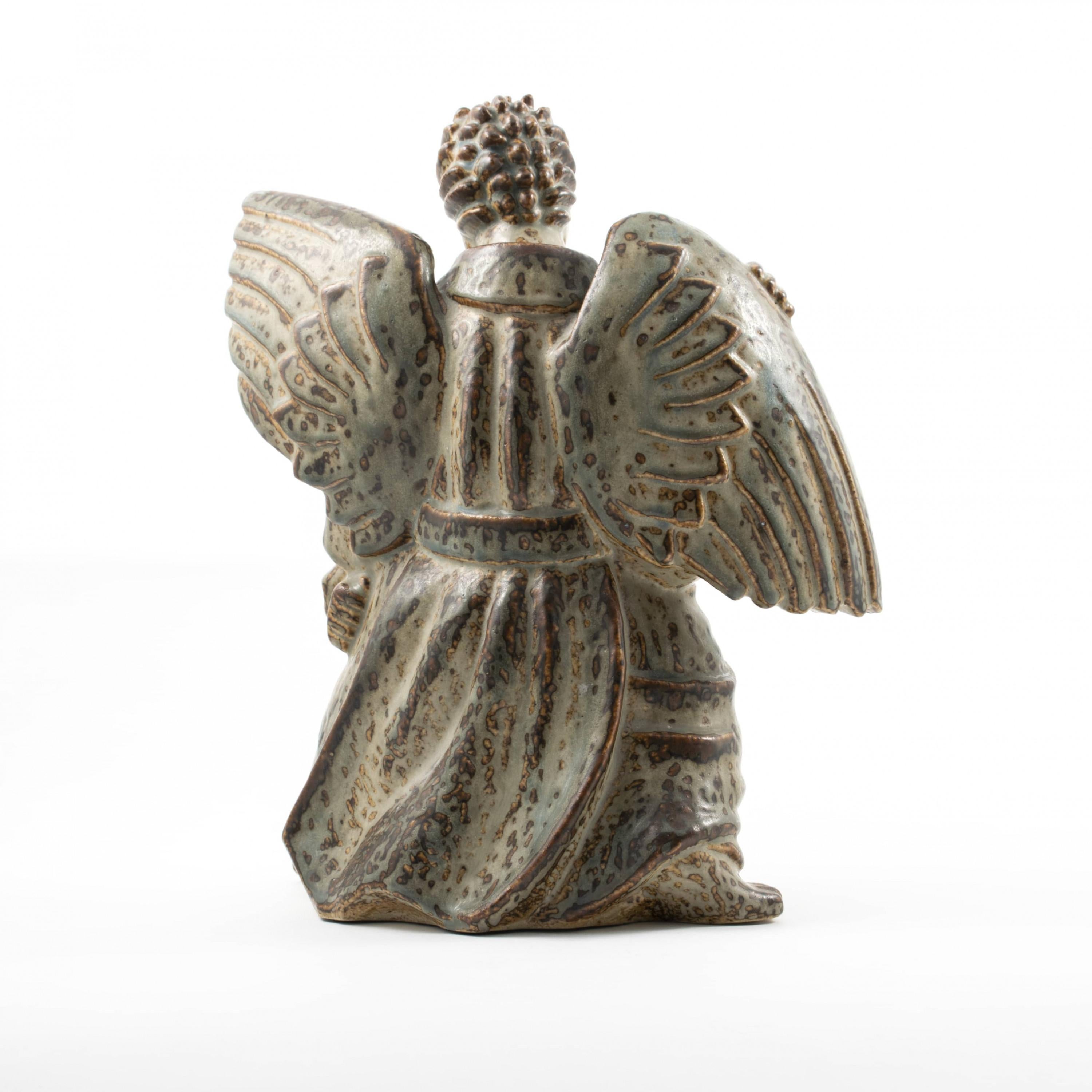 wrestling angels statue