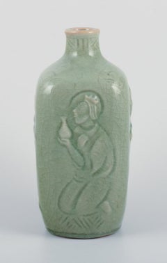 Jais Nielsen, Royal Copenhagen. Ceramic vase in celadon glaze. Religious motifs
