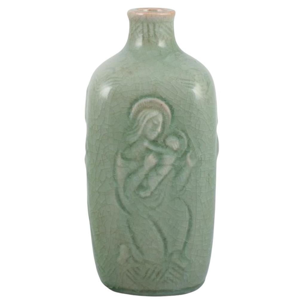 Jais Nielsen, Royal Copenhagen. Vaso in ceramica con smalto celadon. Motivi religiosi