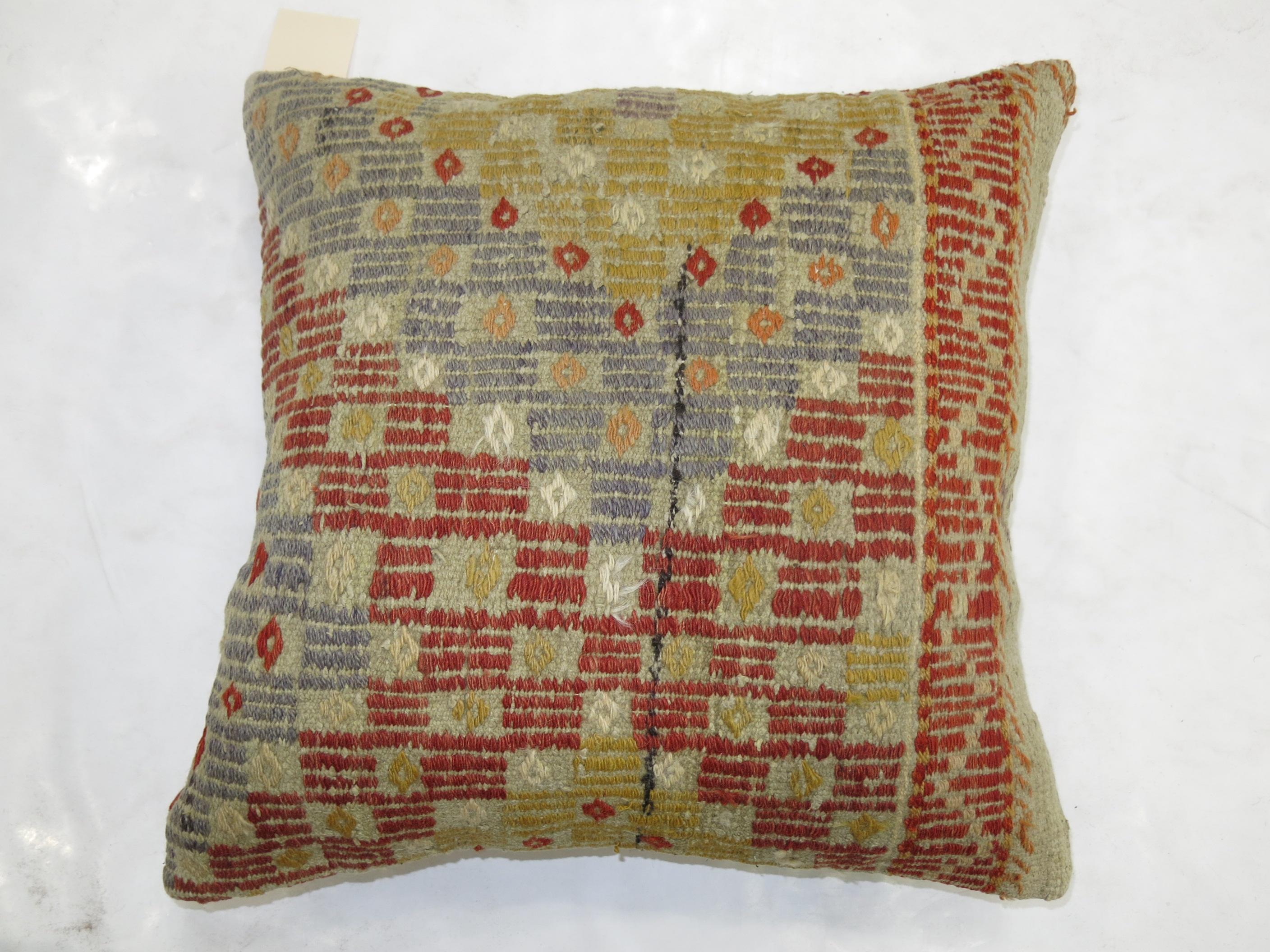 Pillow made from a Turkish flat-weave rug

Measures: 19'' x 19''.