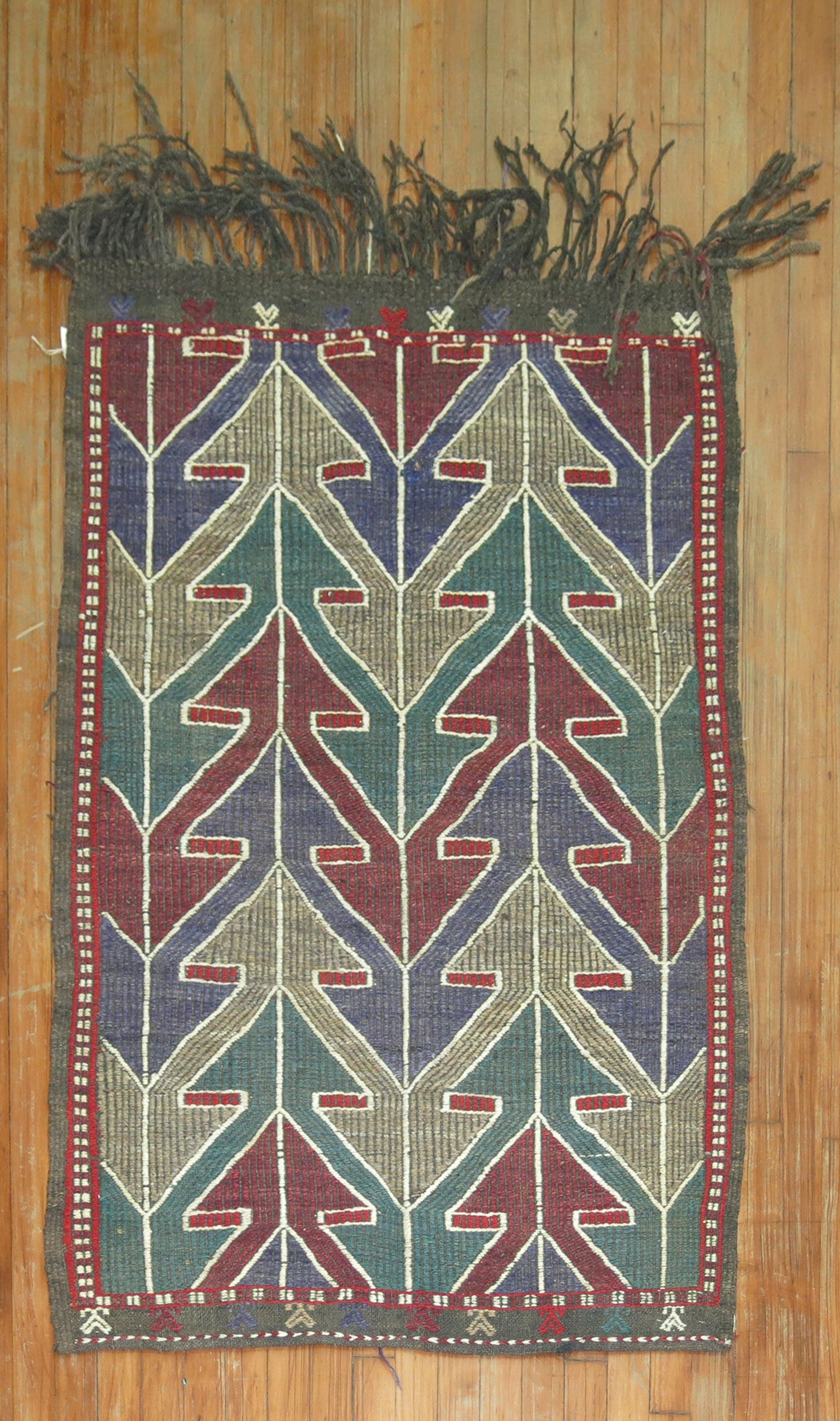 Mid-20th Century Tribal Turkish Jajim kilim 

Measures: 3' x 4'4”

With the Jijim weaving technique, different colored threads are applied between the weft and warp threads, on the reverse of the weave. It is often used to decorate a plain-weave