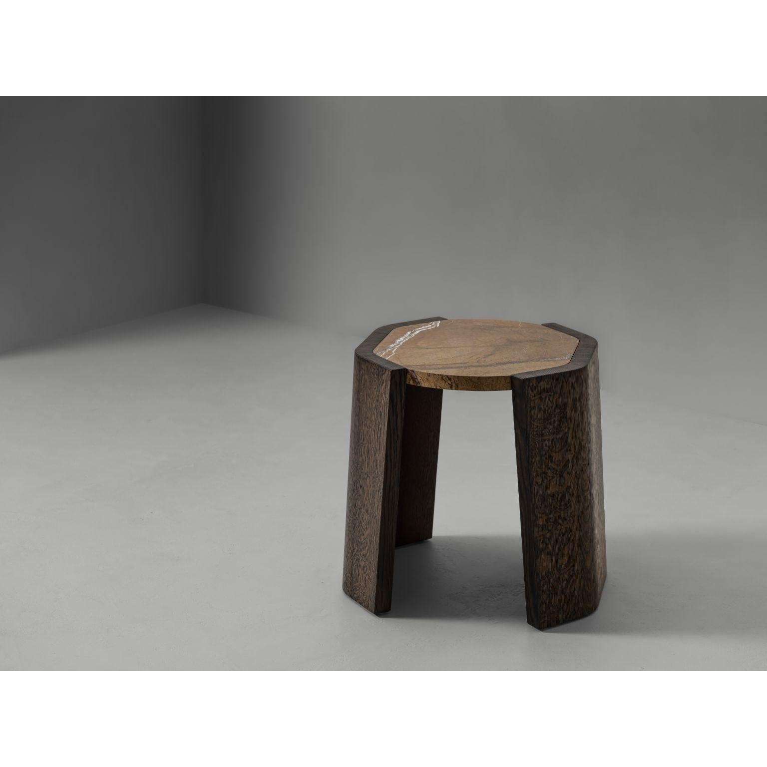 Jak Side Table by Van Rossum
Dimensions: D 55 x W 55 x H 40 cm
Materials: Wood

An alluring side table featuring a rounded octagonal tabletop that is suspended between two crescentshaped legs. Available with French oak legs and a French oak,