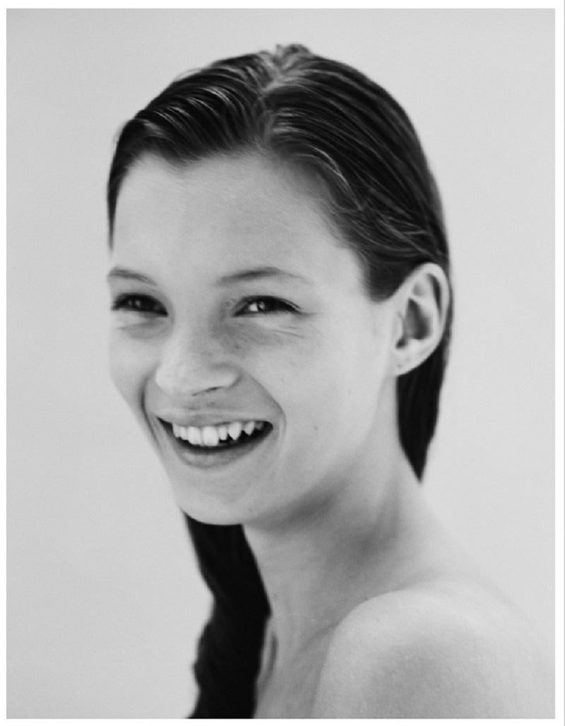 Kate Moss Smiling London, 1990
by Jake Chessum

Portrait of a young 16 year old Kate Moss – before she shot to supermodel stardom and became the icon she is today.

40 x 30" inches / 101 x 76 cm (edition of 7) paper size 
Signed Limited Edition