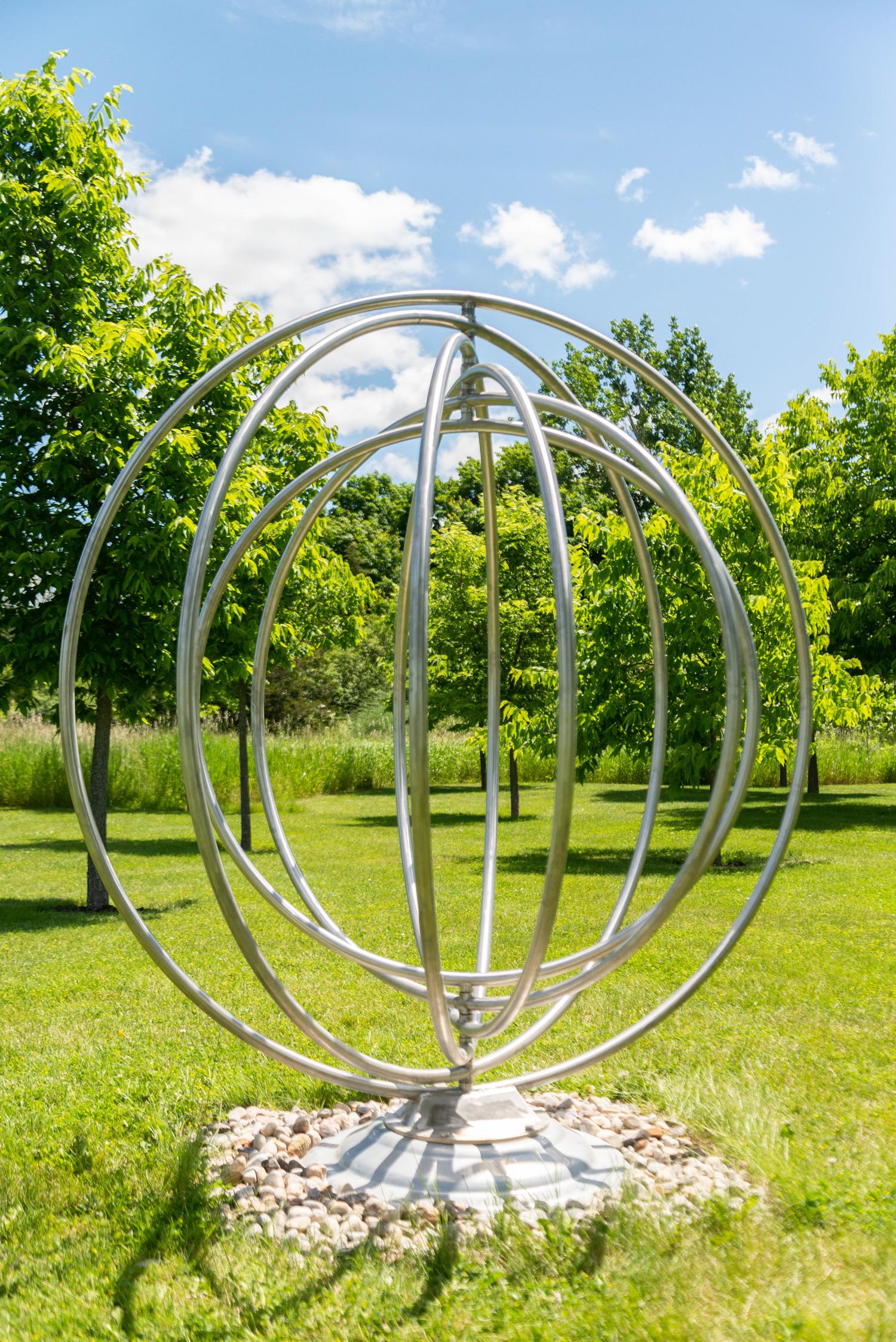 Circle Dance - symmetrical, kinetic stainless steel outdoor sculpture - Contemporary Sculpture by Jake Goertzen