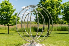 Circle Dance - symmetrical, kinetic stainless steel outdoor sculpture
