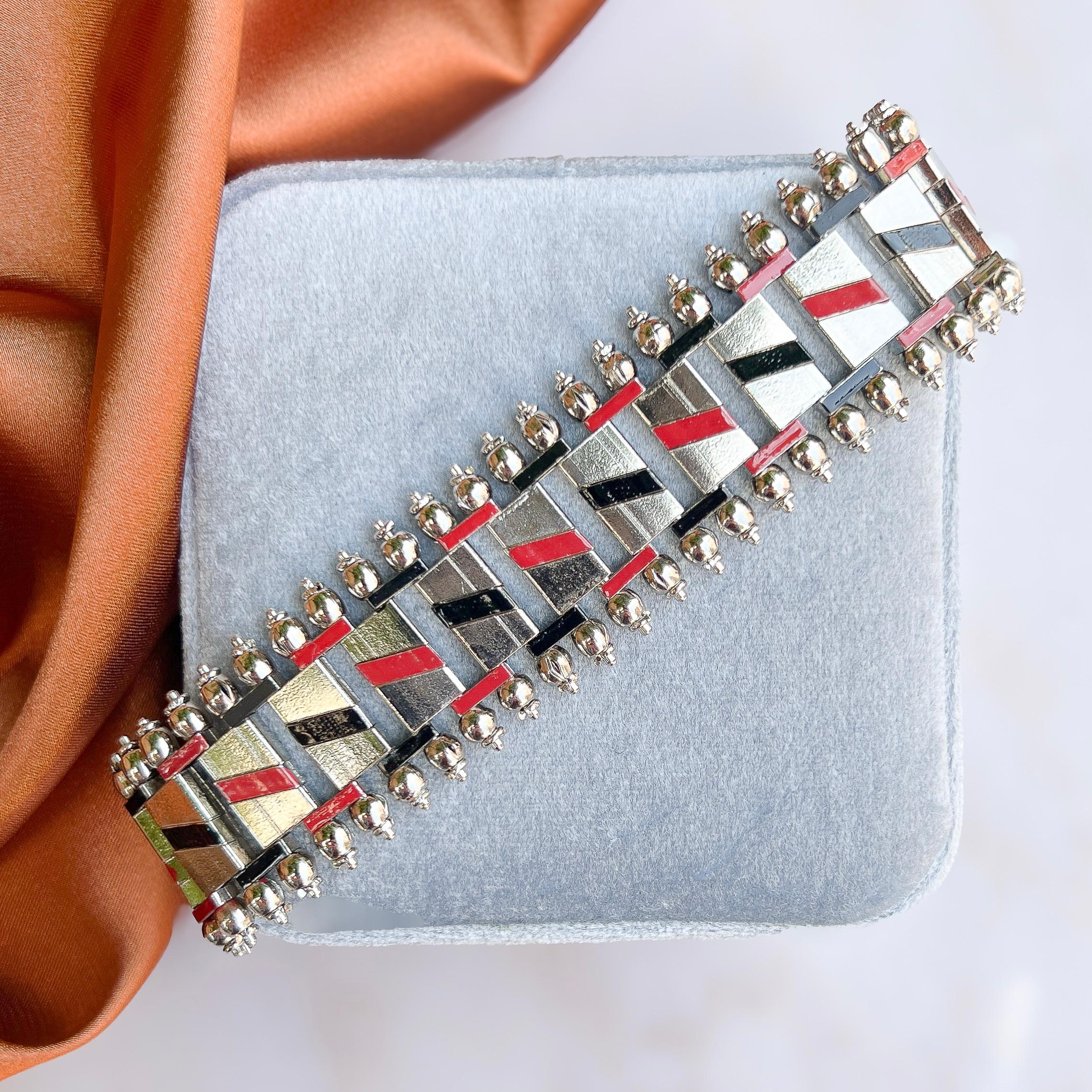 This stylish bracelet dates from the 1930s and was created by Jakob Bengel. 

Condition Report:
Very Good - Some loss to the enamel in one small area. This is only visible upon very close inspection and does not detract from the appeal of the