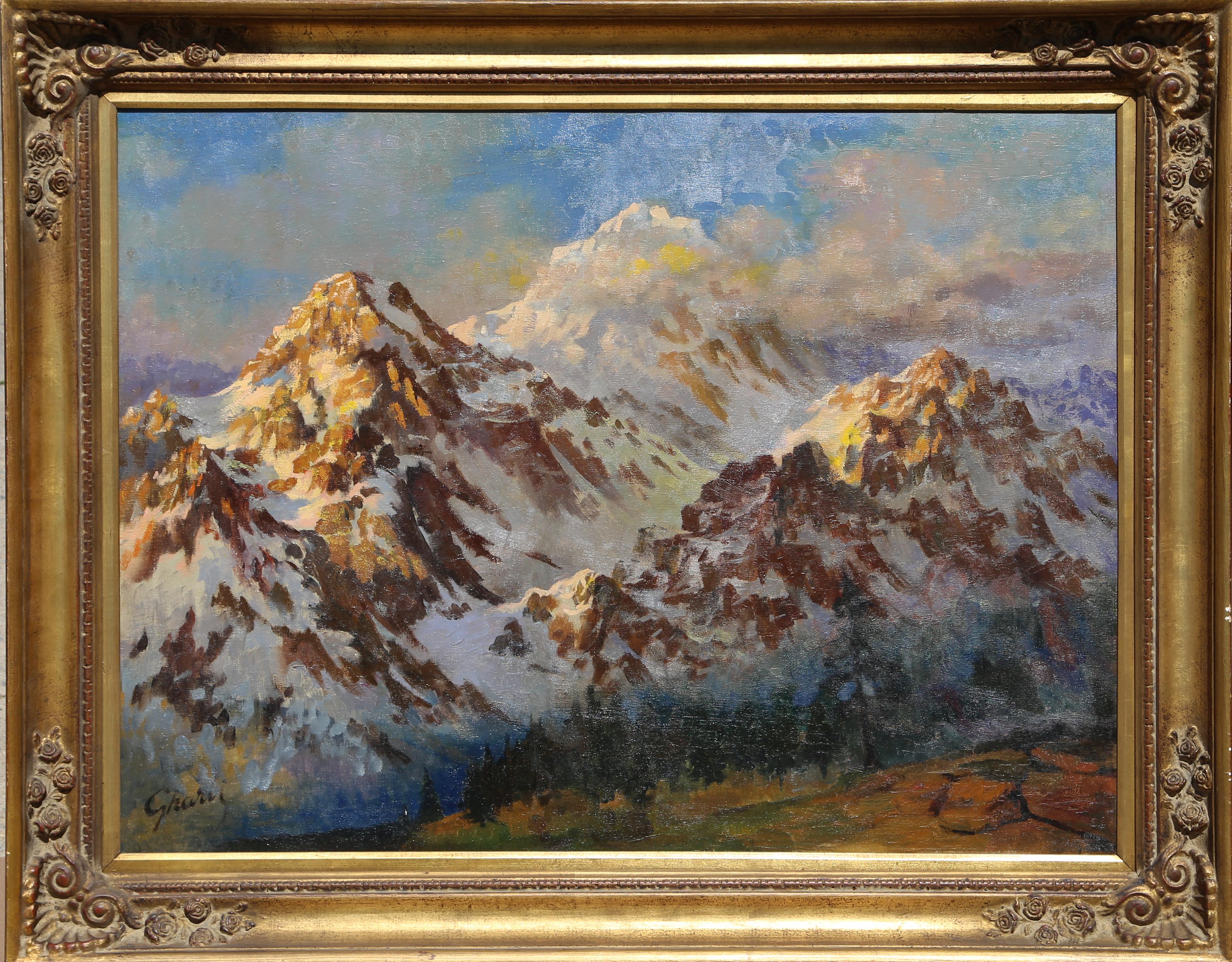 A large oil painting of a dramatic Mountain Range by Tunisian-born artist, Jalal Gharbi (1920 - 2005).  The painting measures 30 x 40 inches and the frame 37.5 x 47.5 inches.