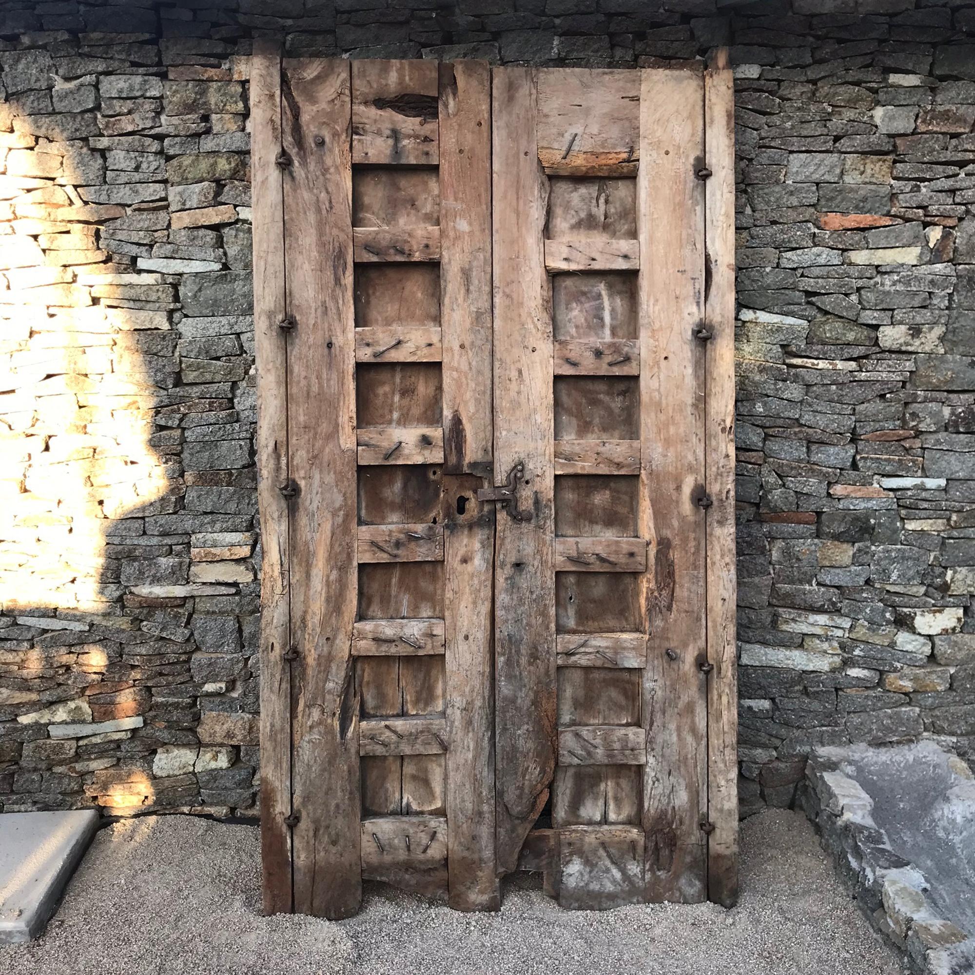 Rustic Door
From an old Hacienda in Jalisco, Mexico door in solid mesquite wood circa 1910-1920. 
Handmade by Mexican Artisans utilizing extremely hard Mesquite wood.
Dimensions: 47 W x 81.5 H x 4D, Each door panel 20.5 W inches
An unrestored item