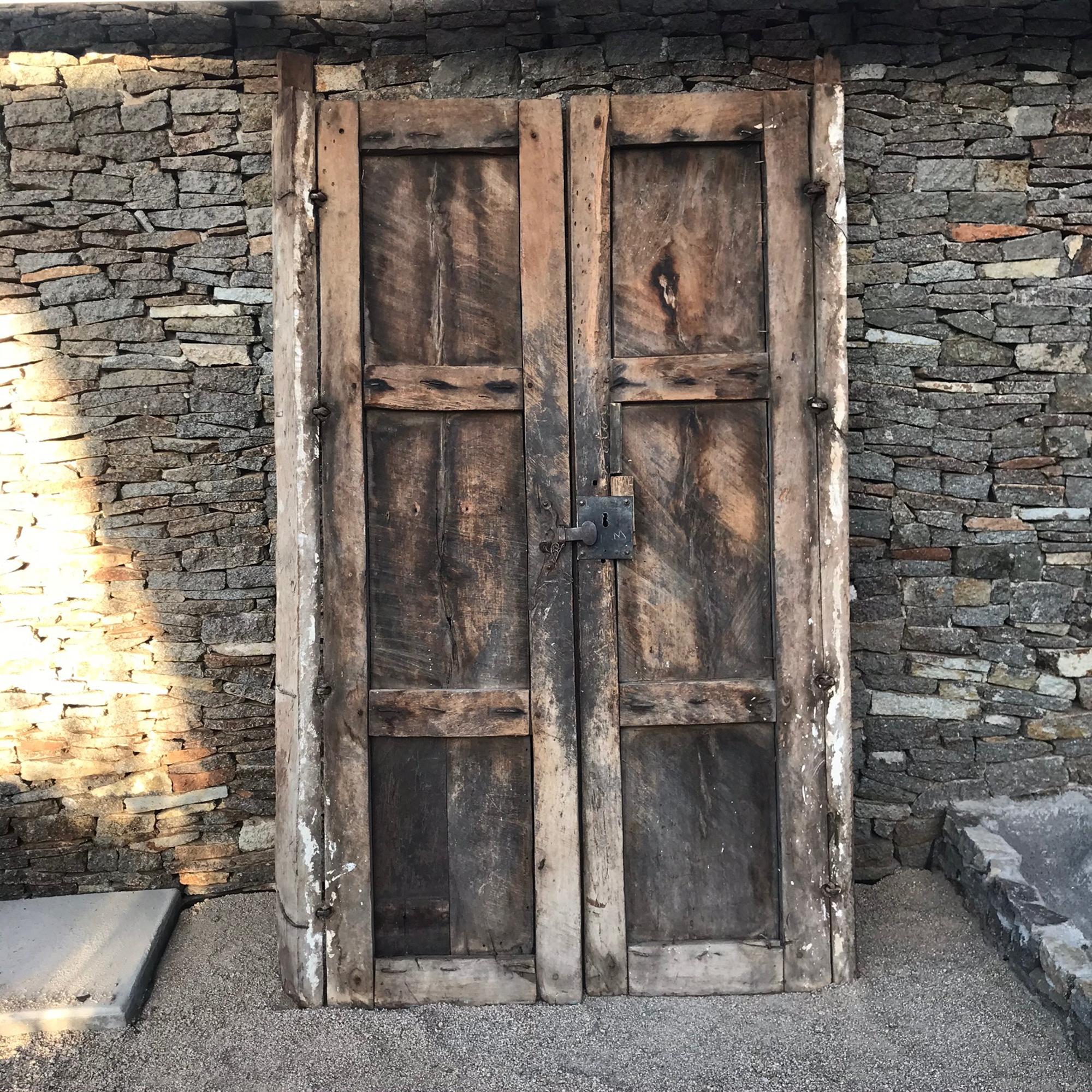 Mexican Hacienda Rustic Green Door Solid Mesquite Wood circa 1910-1920.
Handcrafted by Mexican Artisans Jalisco Mexico
48.5W x 81 H x 4.5 D each door panel is 21.75
An unrestored vintage item in wonderfully distressed condition.
Refer to