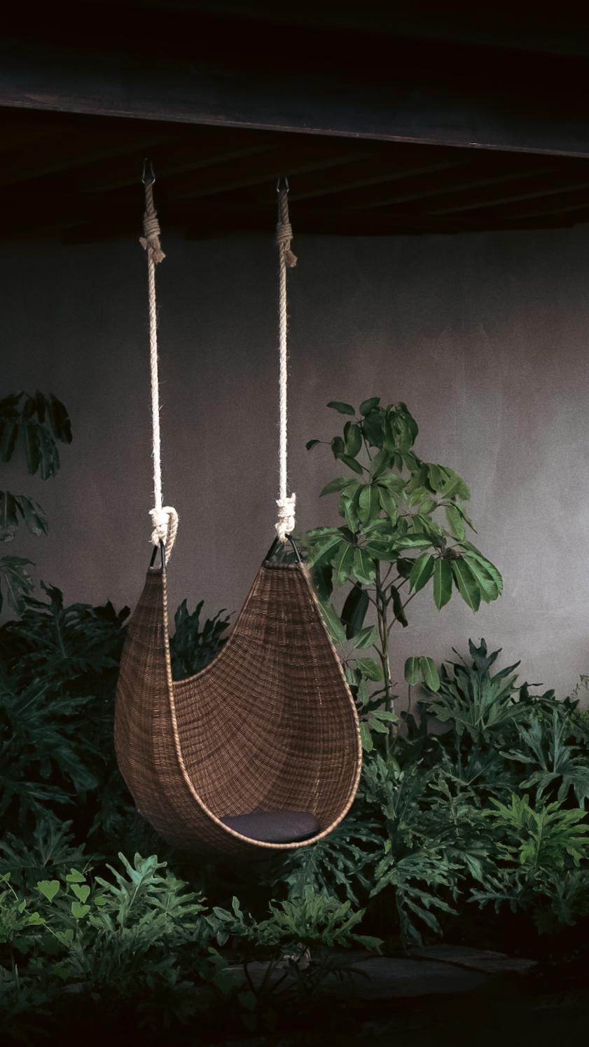 An indoor/outdoor hanging lounge chair handwoven by master artisans from central Mexico. Christian Vivanco designed the Jamapa Hanging Lounge Chair inspired by hammocks and traditional woven bags, carefully analyzing how they behave and alter their