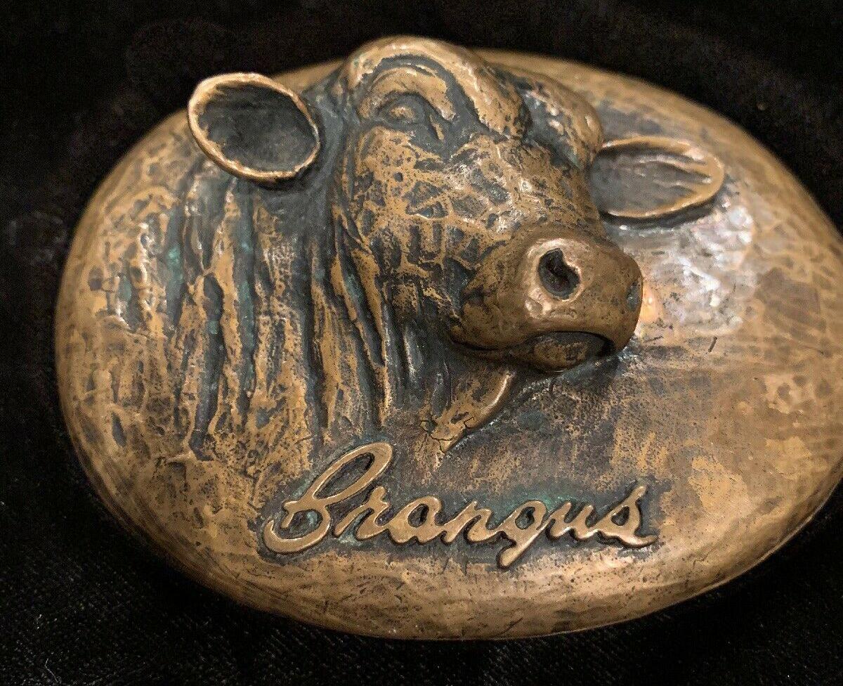 A Superb design featuring a Rare Vintage James Avery Sculptural Cast Bronze Brangus Cattle Belt Buckle by renowned Texas maker AVERY. It depicts a 3-dimensional bovine/cow. Solid bronze with the James Avery logo trademark and marked: BRONZE on the
