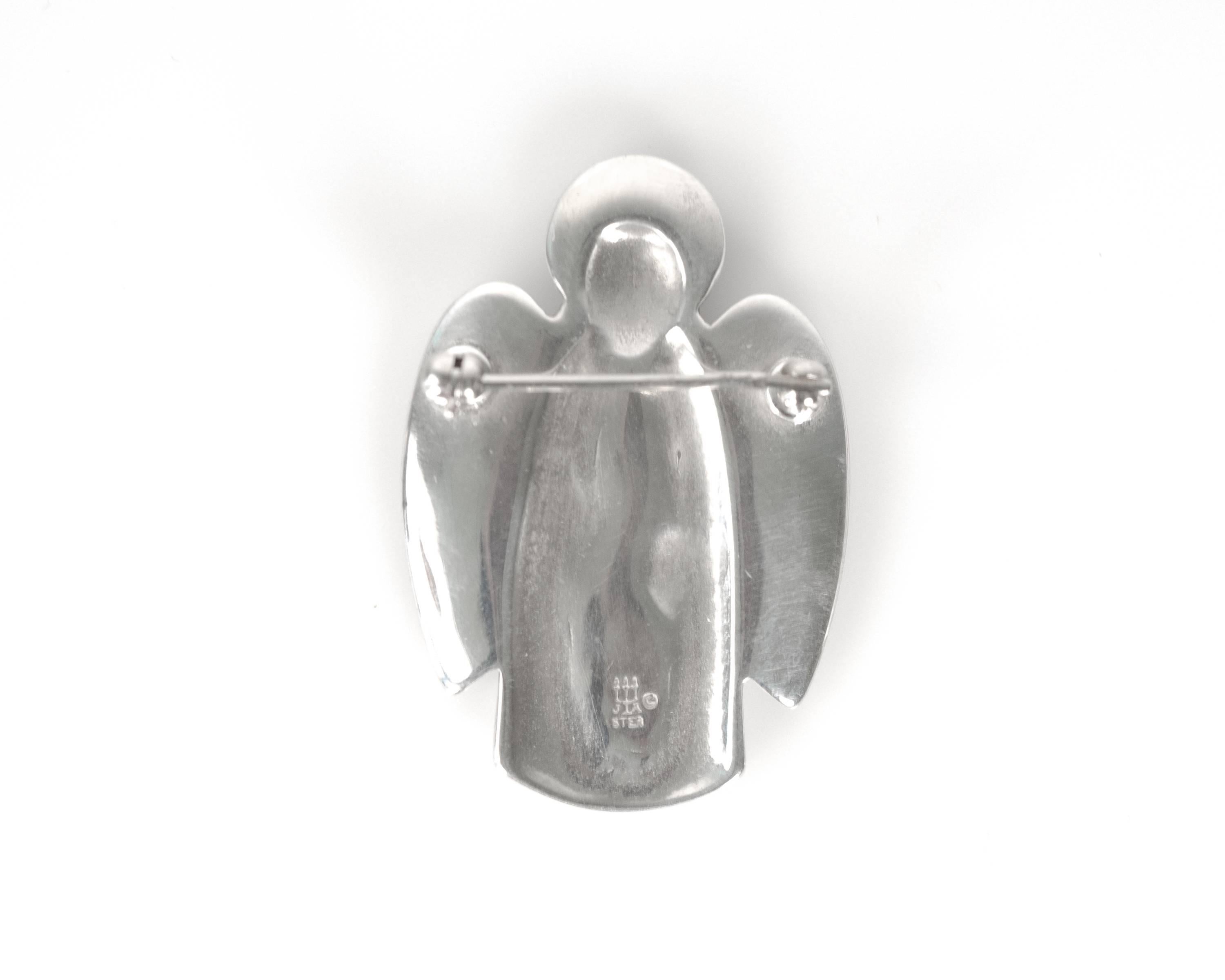 James Avery Guardian Angel Pin, Sterling Silver

Iconic All-American jewelry designer James Avery keeps things simple.
This beautifully designed and crafted pin features an angel and 2 smaller figures. The angel's wings wrap gently around the small