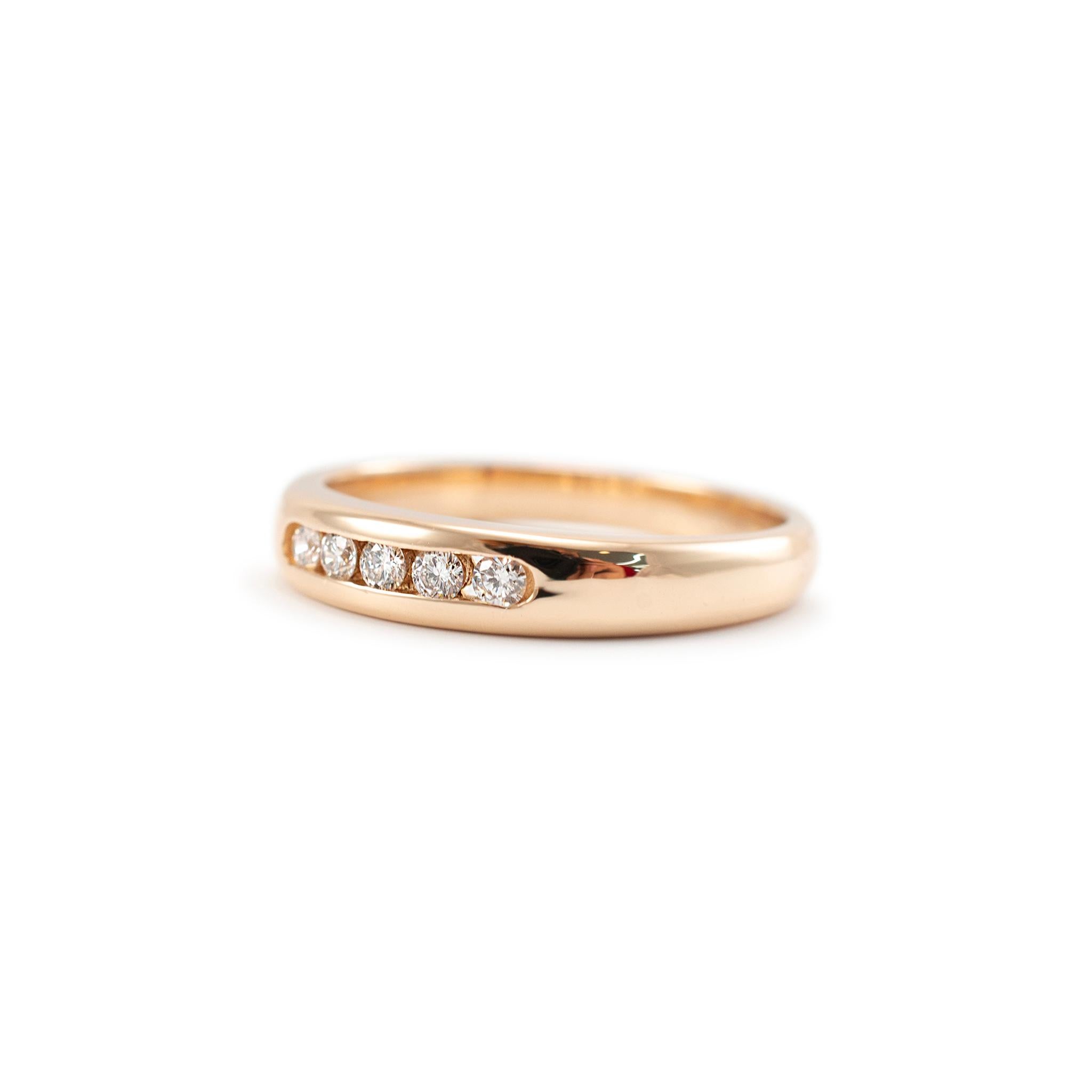Brand: James Avery

Gender: Ladies

Metal Type: 18K Yellow Gold 

Size:  8

Width: 4.00 mm

Weight: 4.42 Grams

18K Yellow Gold five-across diamond wedding band with a half-round shank. The metal was tested and determined to be 18K yellow gold.